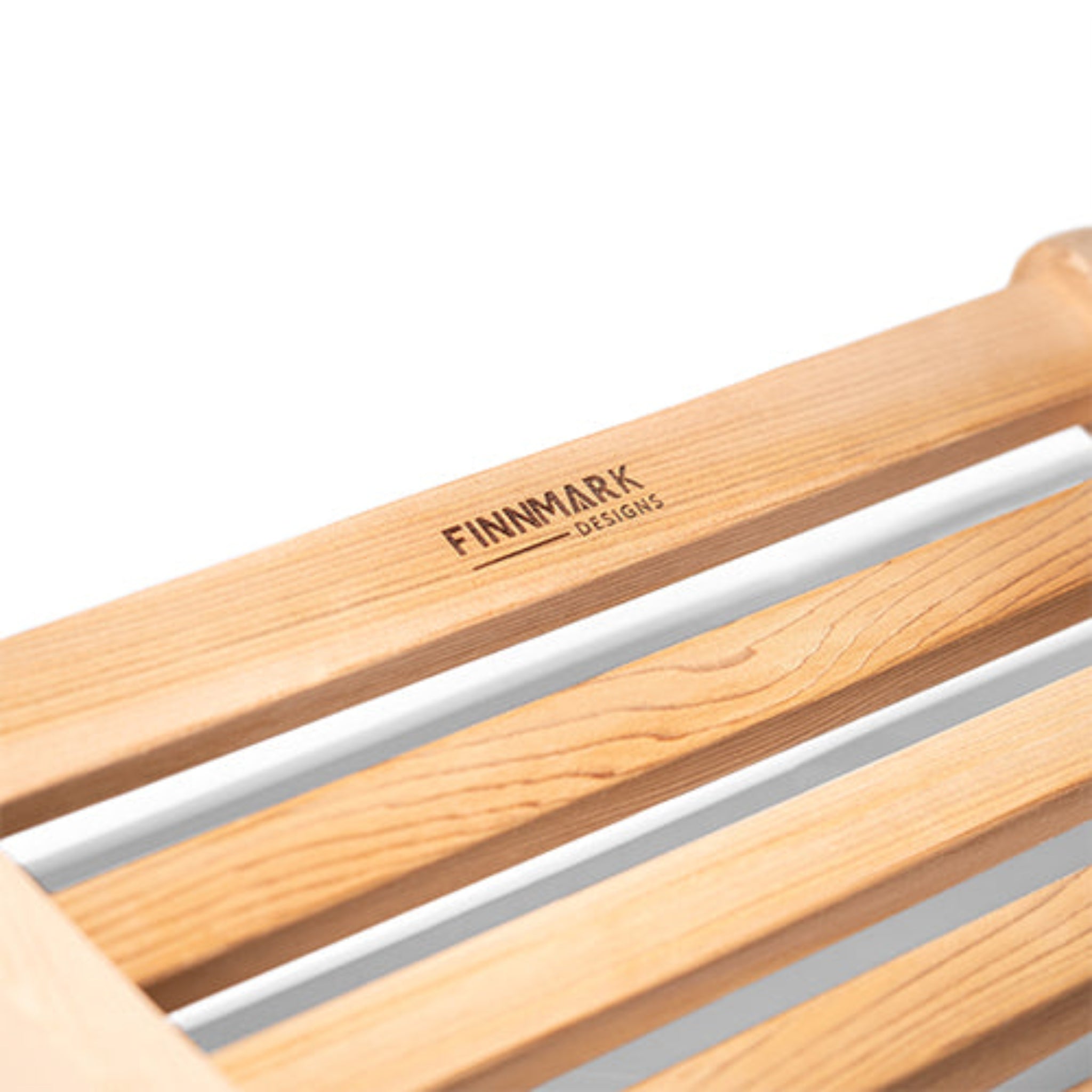 Finnmark Ergonomic S-Shape Sauna Backrest close up of brand name