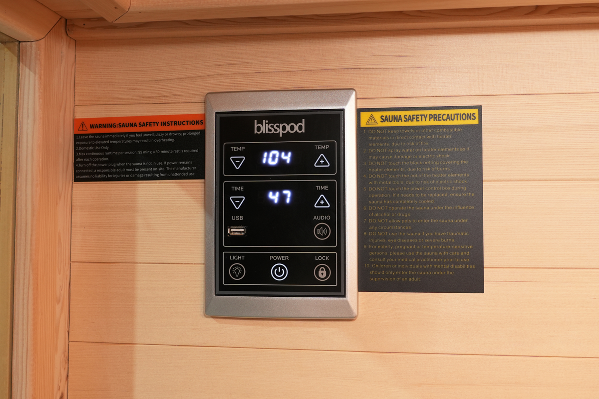 Control panel of full spectrum infrared sauna showing temperature and timer settings for Blisspod Vantaa RED.