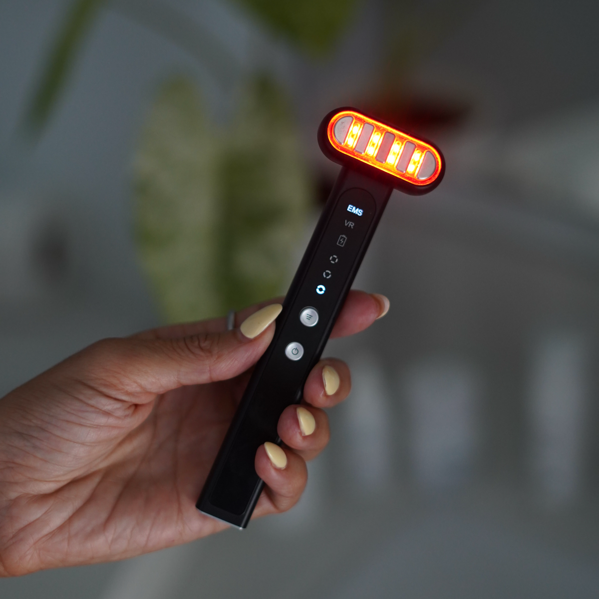 TheraSculpt™ Facial Sculpting & Red Light Therapy Device hand-held tool with red lights for skincare.