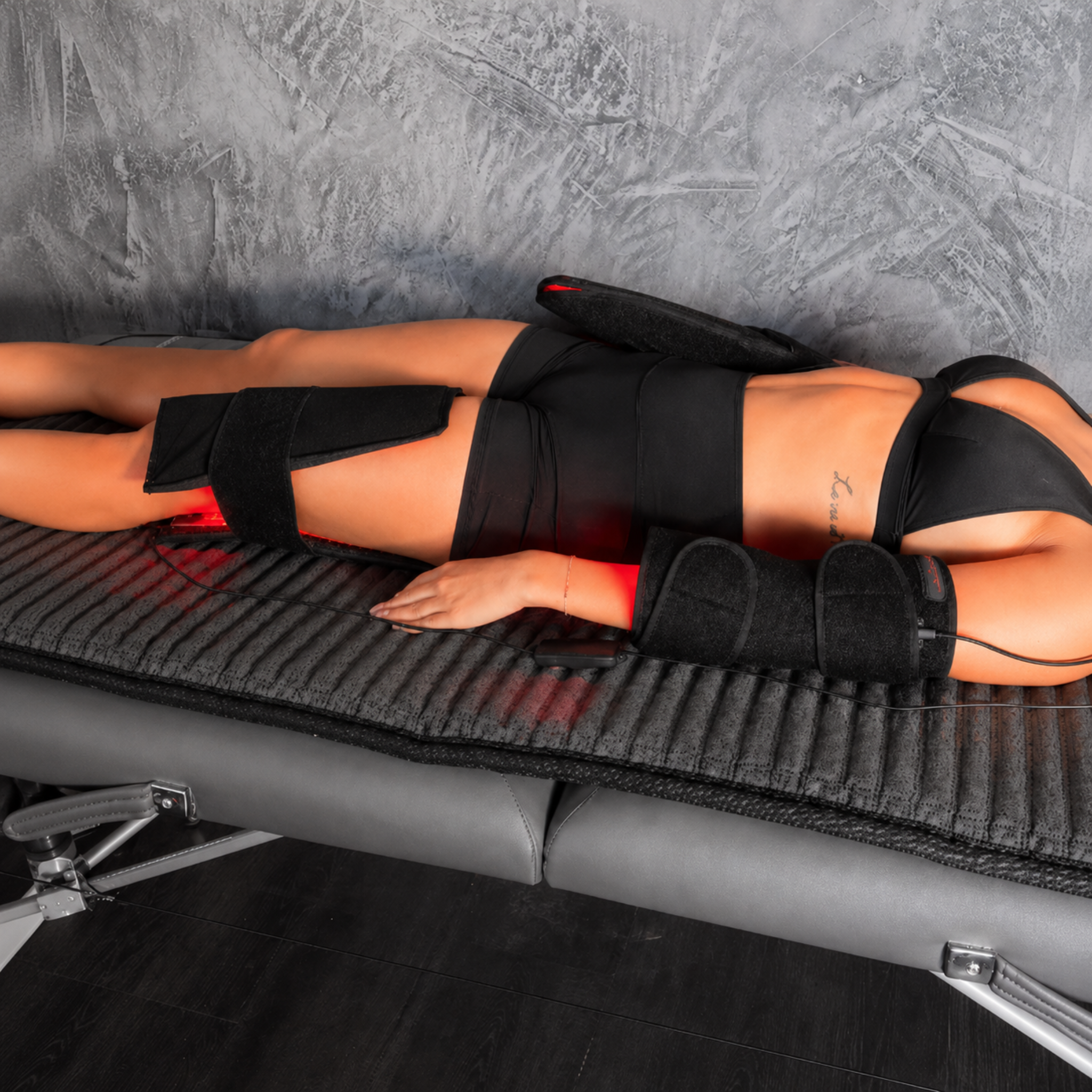 Red Light Pro 3-in-1 Flexible LED Pad | 540 LEDs | 660nm + 850nm | 7" x 11" in use on a person for therapy.