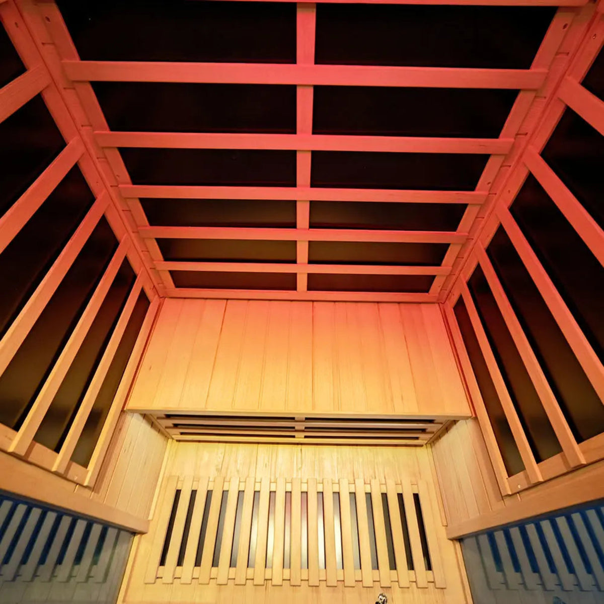 Interior view of a 2-person infrared sauna hemlock with wooden panels and ambient lighting.