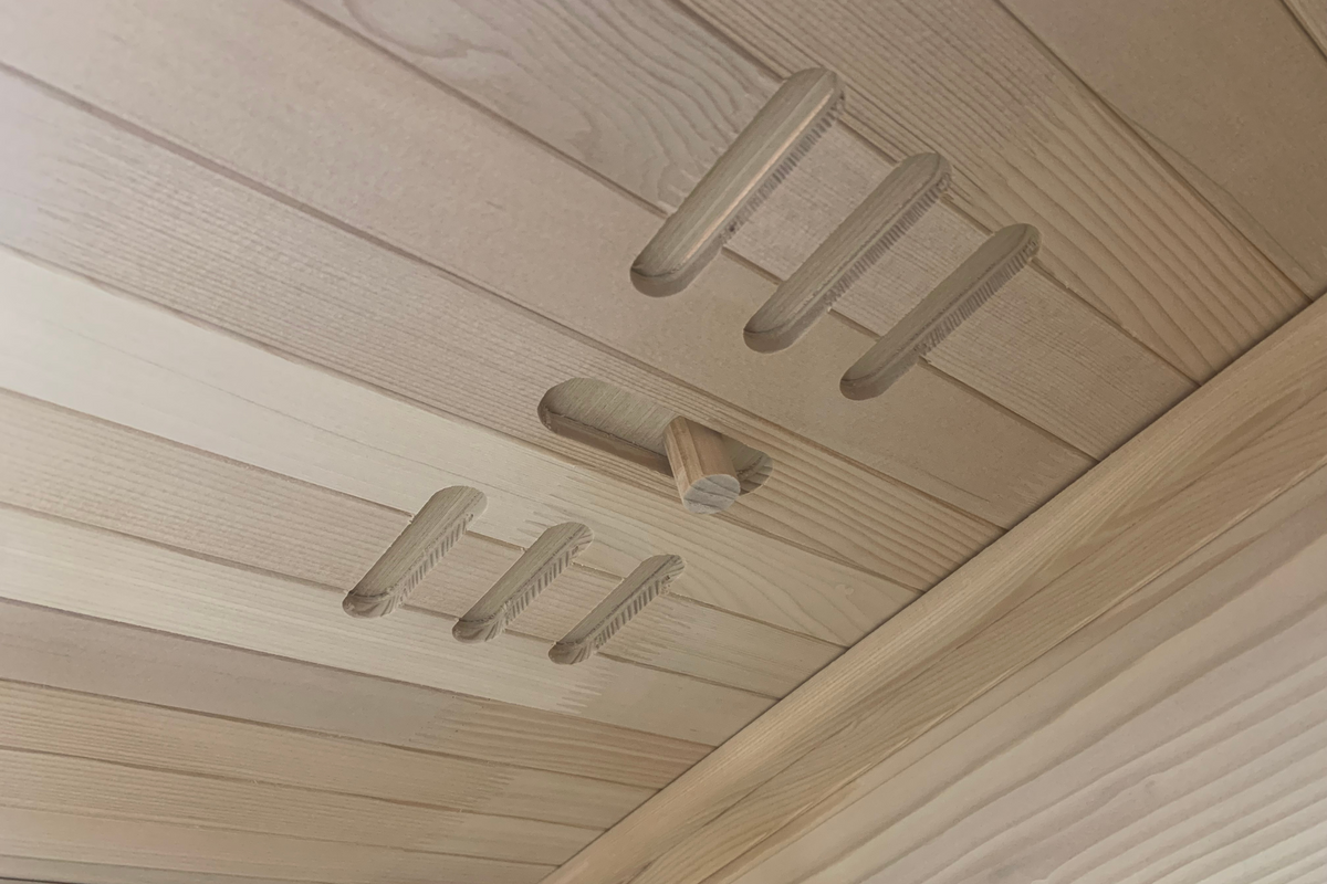 Interior view of the Blisspod Vienna 1-Person Far Infrared Sauna featuring Canadian Hemlock wood design.