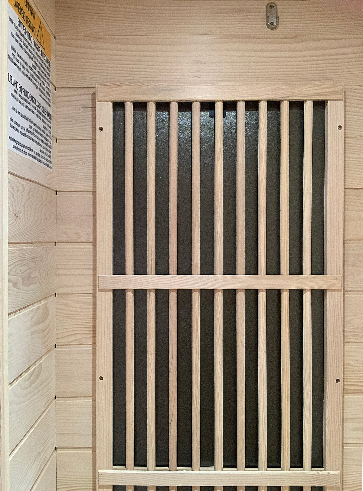 Interior view of a Blisspod Vienna 1-Person Far Infrared Sauna with wooden slat door.