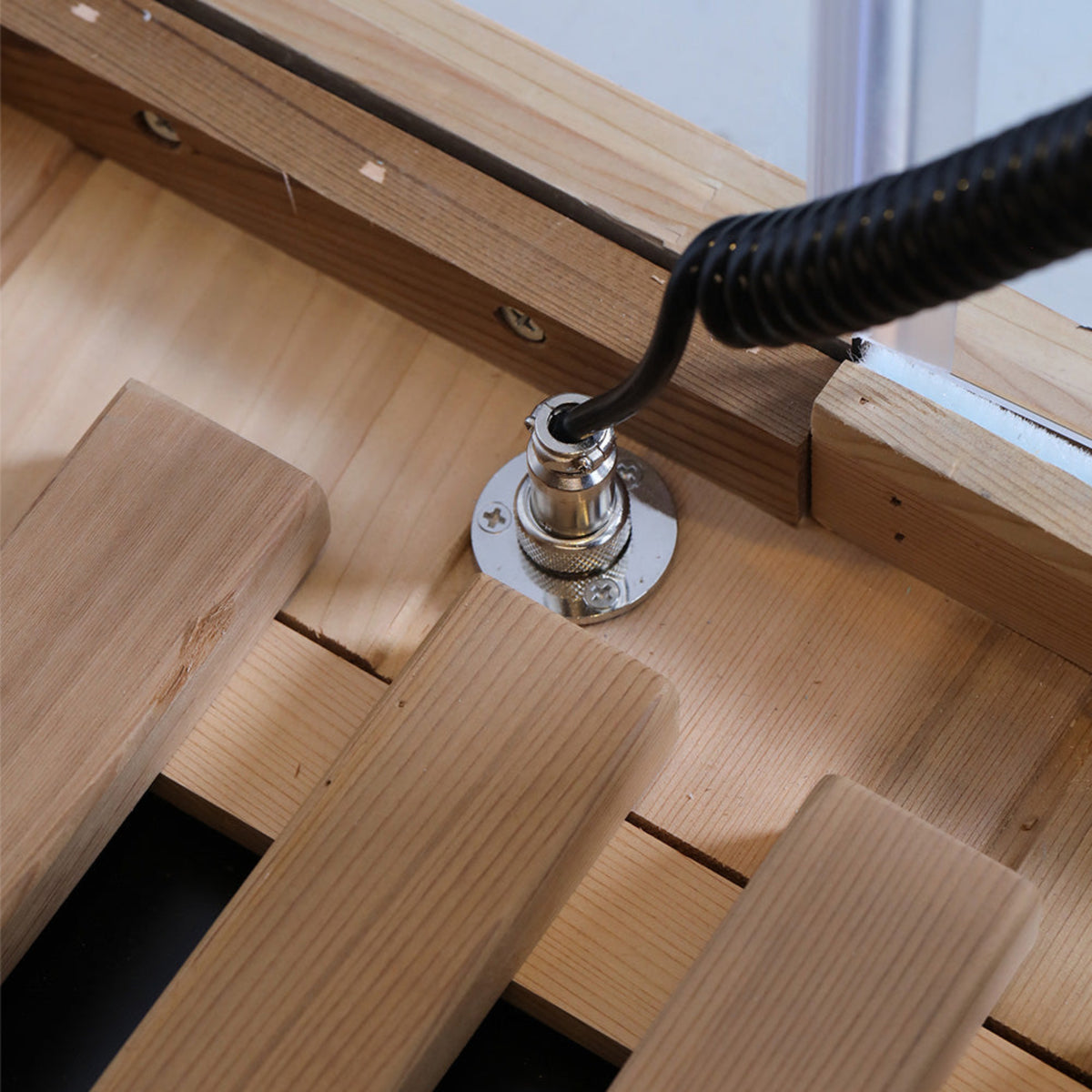 1-person infrared sauna red cedar connection detail showing wooden slats and heater panel installation.
