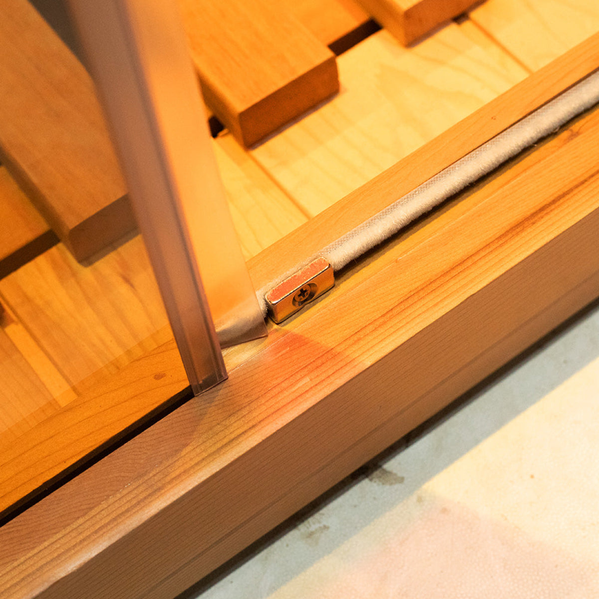 Wizzisaunas S03 3-person infrared sauna – close view of front lower bottom panel