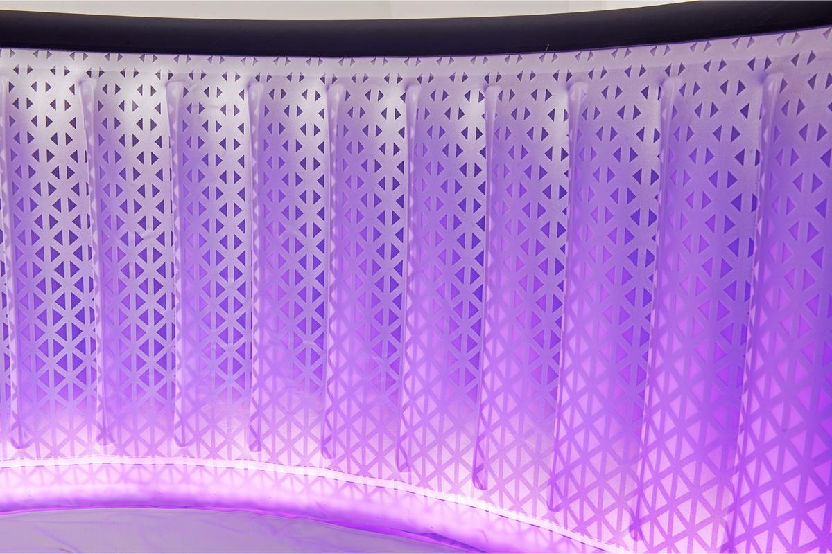 Decorative panel with geometric pattern and LED lighting on a curved surface