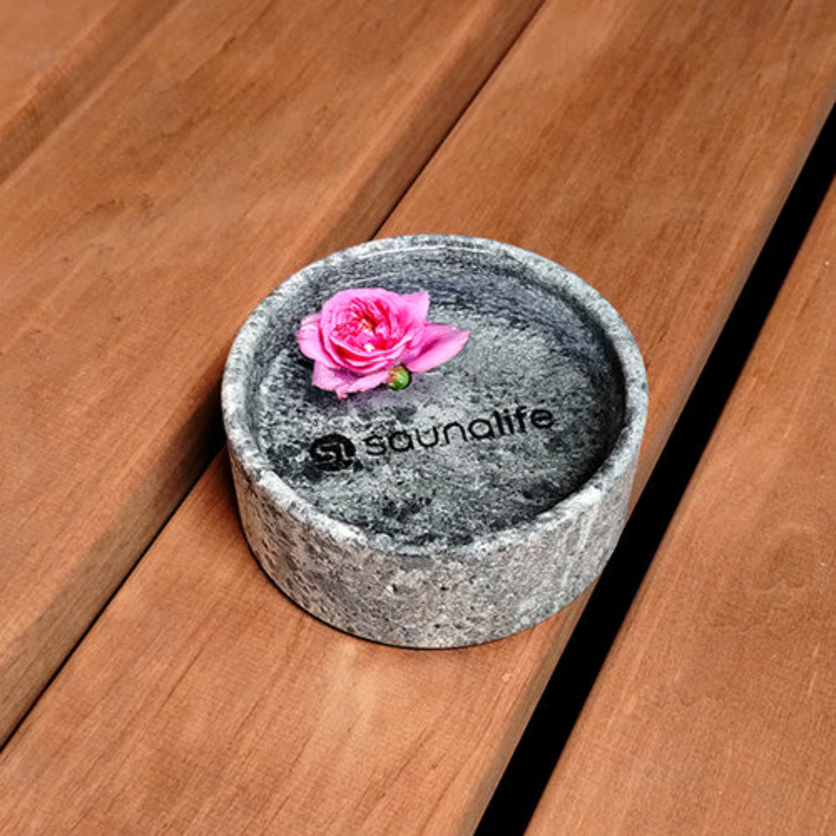 SaunaLife Coaster and Aroma Tray with a pink flower on a wooden surface, featuring the 'saunalife' brand.