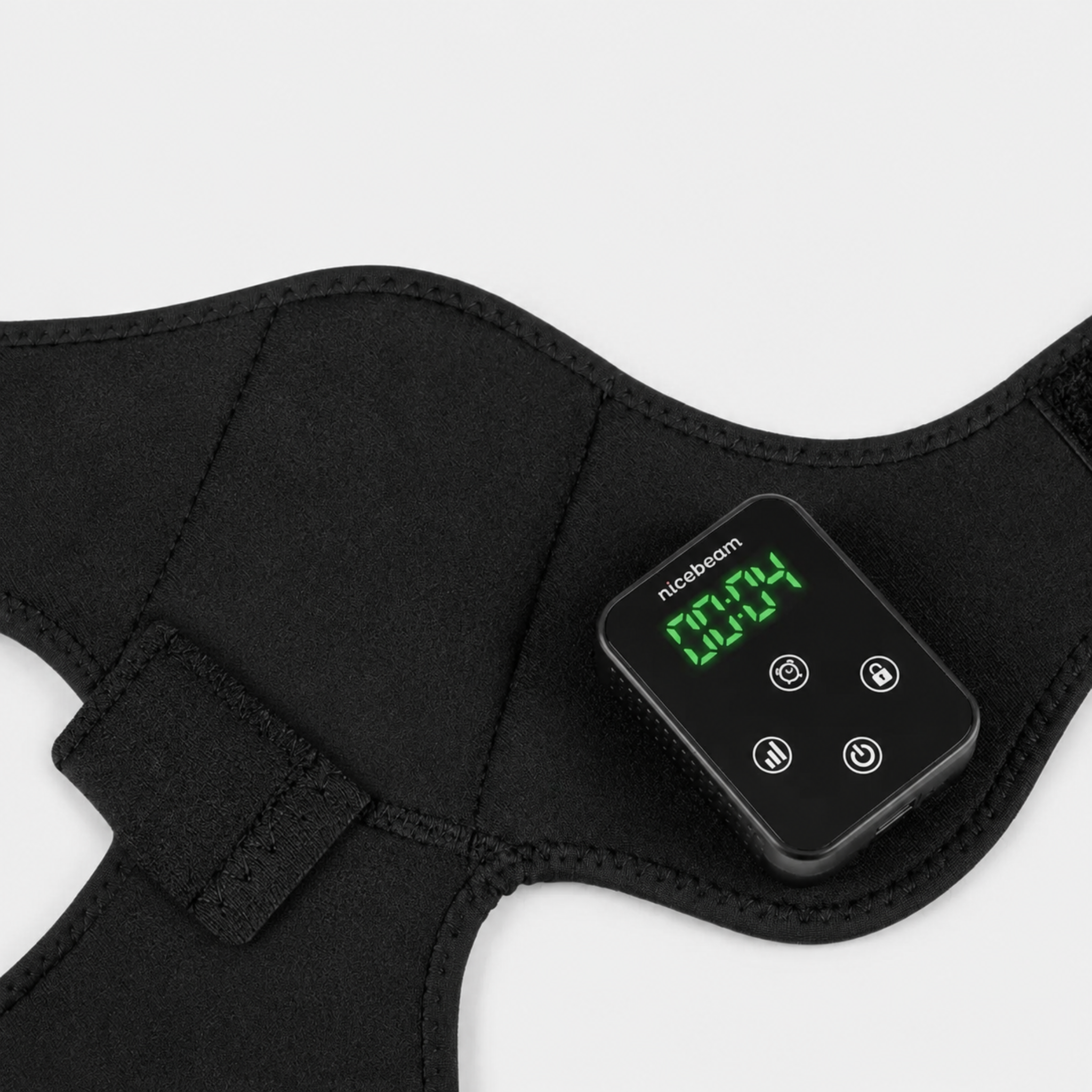 Black Nicebeam red light therapy knee wrap opened up with digital display showing on a white background.