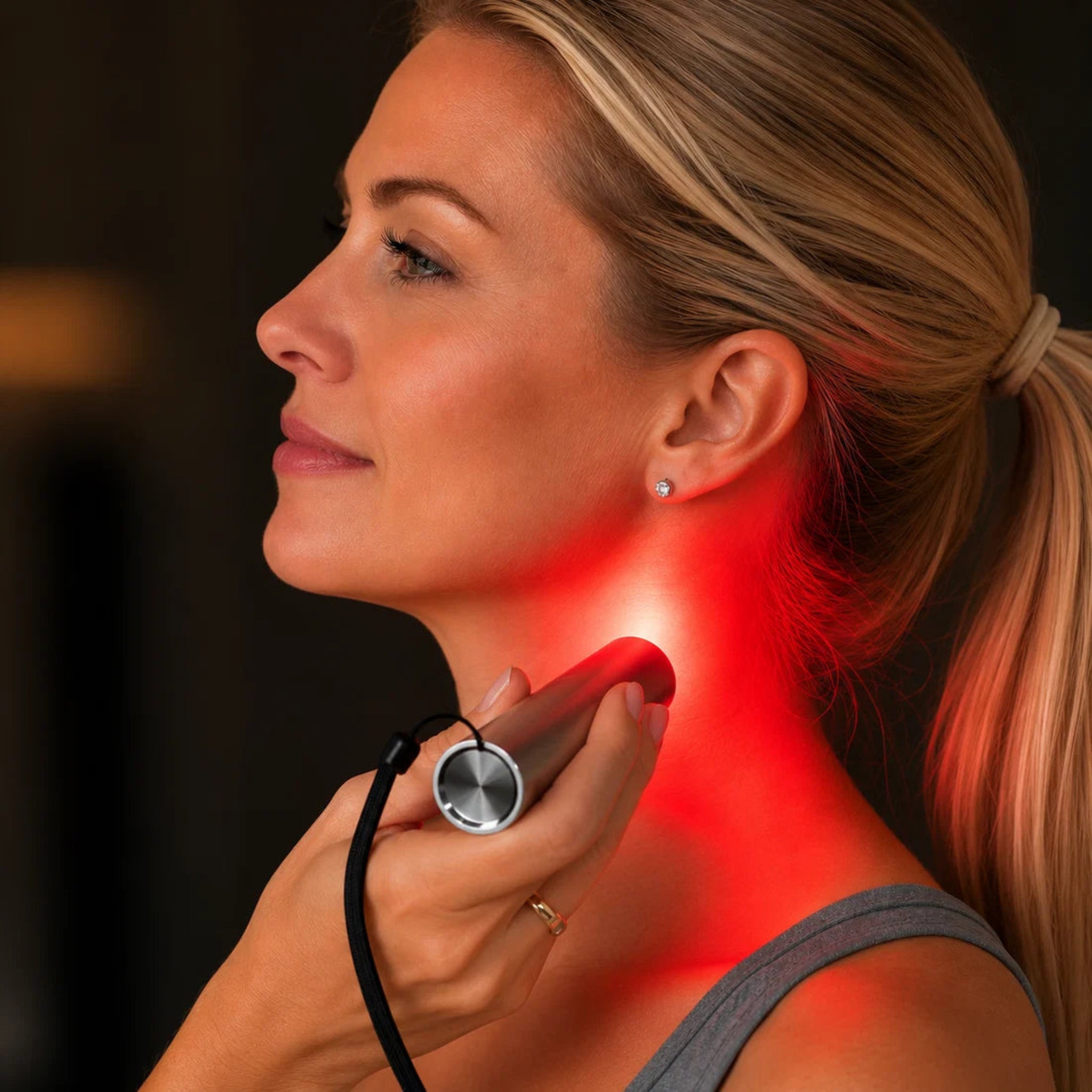 Red Light Pro Devices LED Torch – 5-Wavelength Portable Red & Near-Infrared Light Therapy in use on neck.