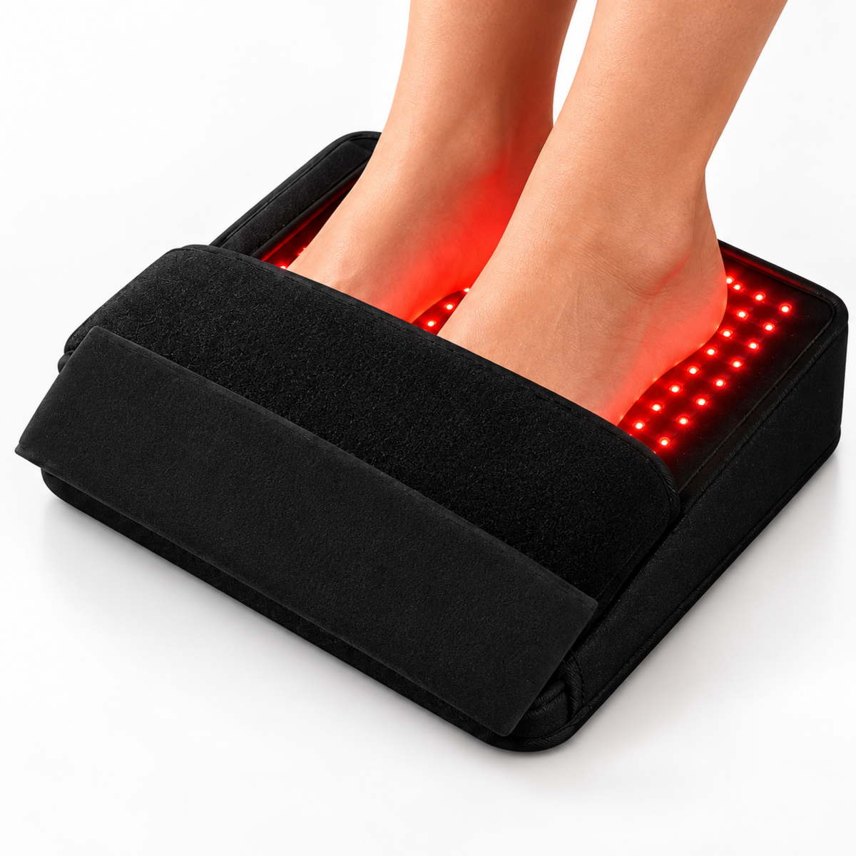 A person's feet resting on a black LED foot bath device that glows with red light, shown on a clean white background.
