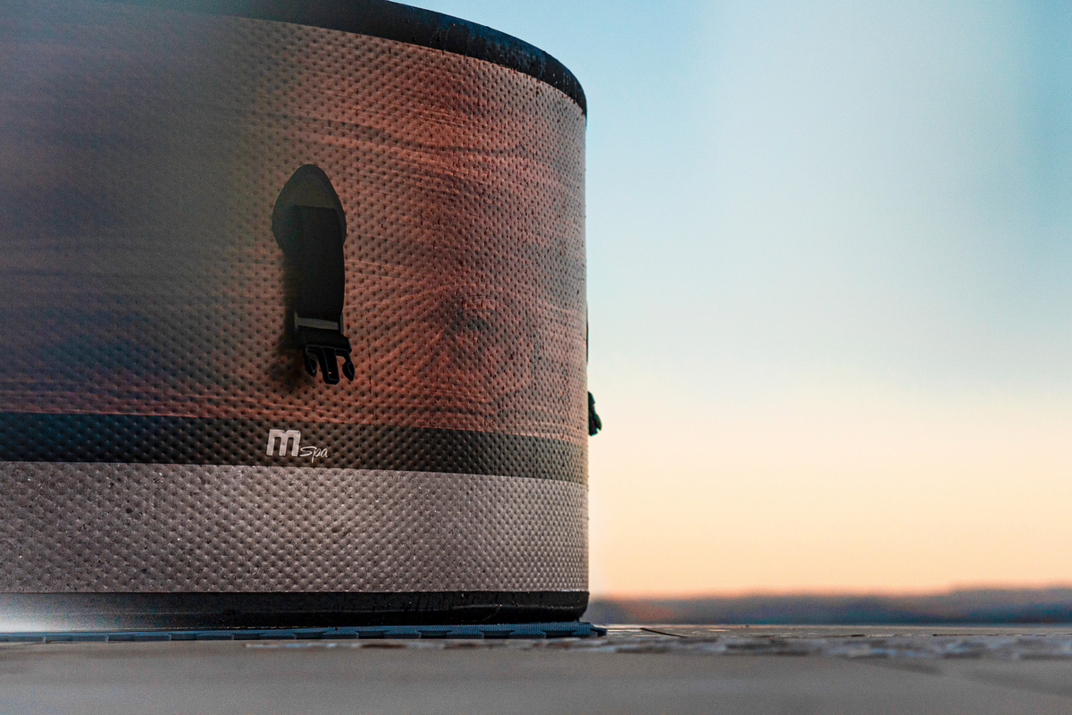 MSPA Duet Verto Series rigid hot tub showcasing its design against a scenic sunset background.