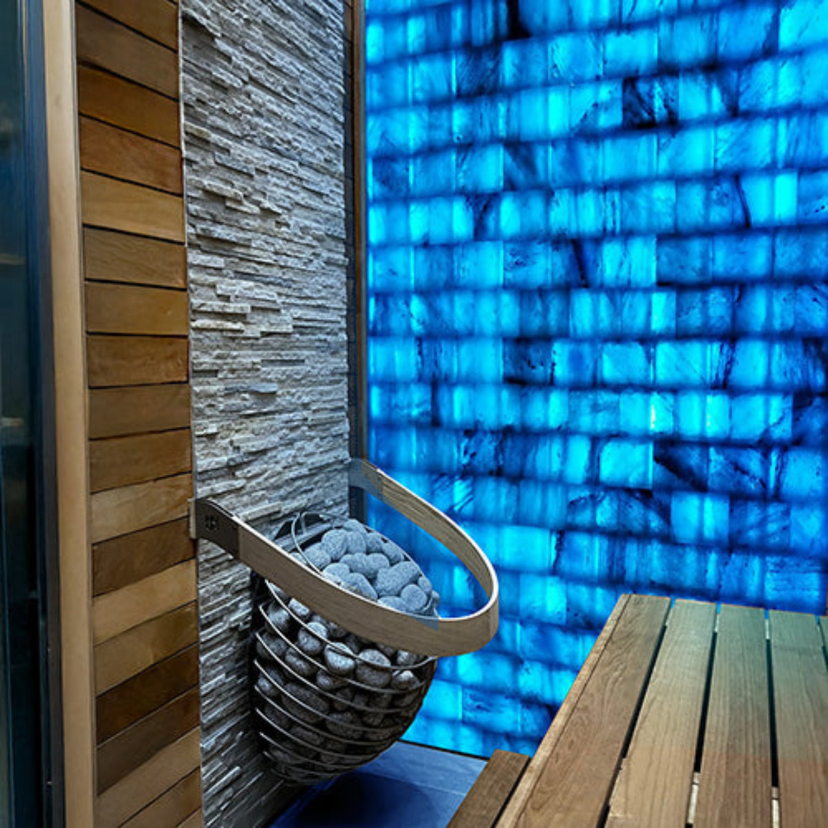 PROSAUNAS blue Himalayan Salt Wall in a sauna showing a heater with stones