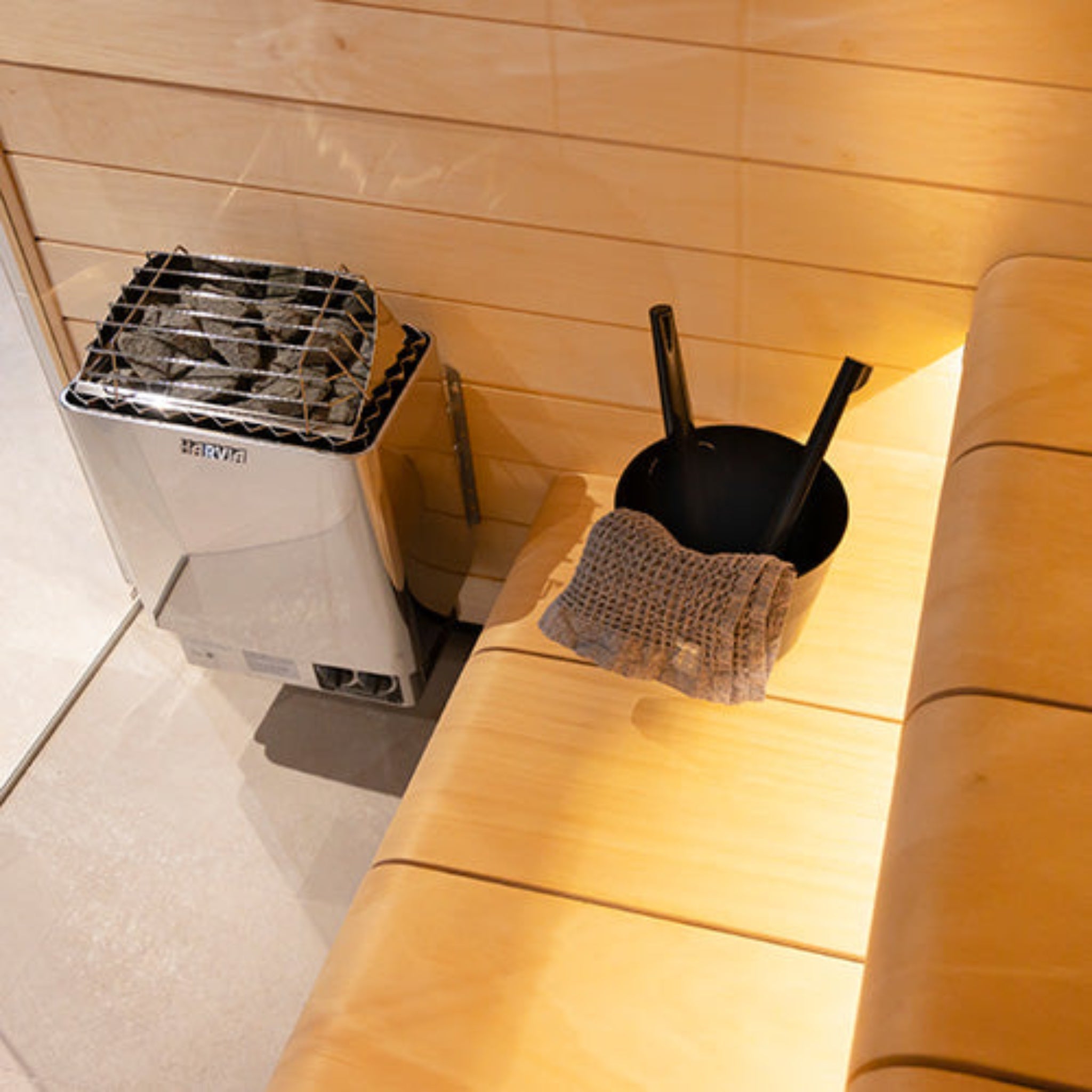 Harvia KIP45B sauna heater — lifestyle view showing heater installed in sauna