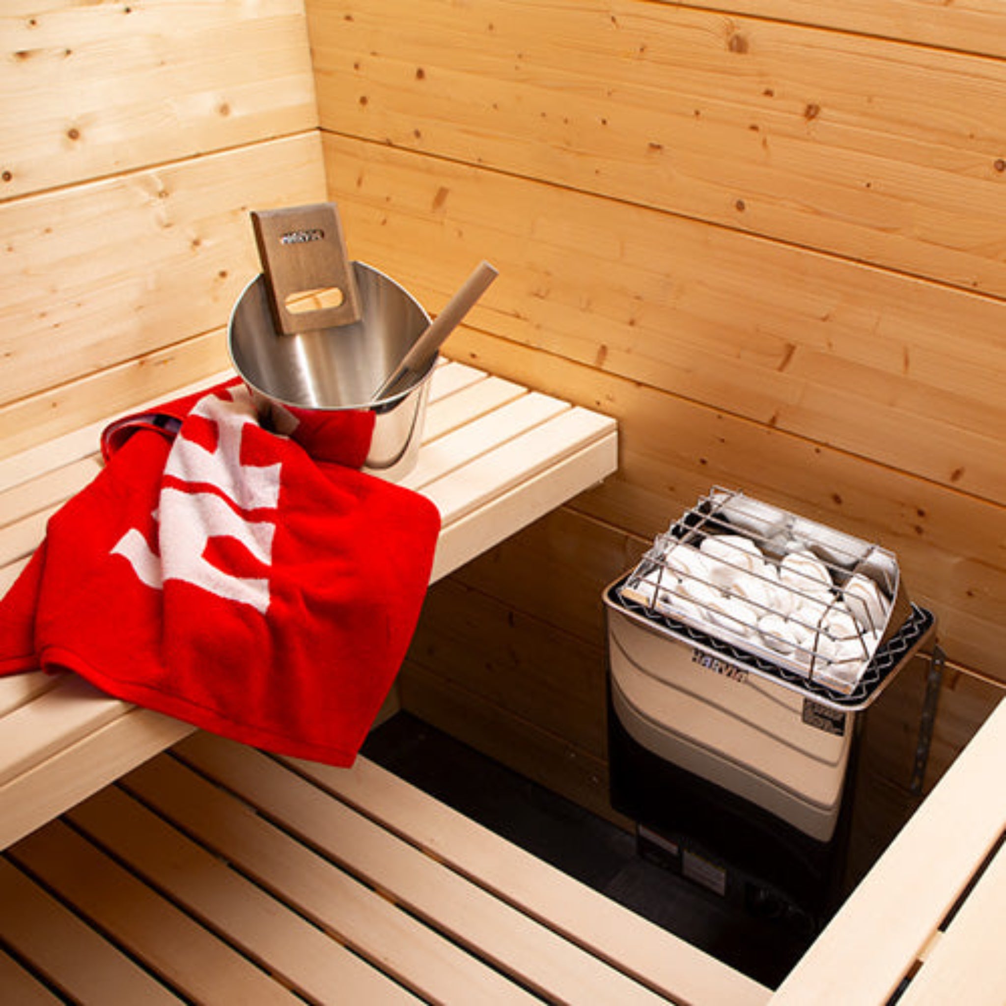 Harvia KIP45B sauna heater — side angle view showing stainless steel housing