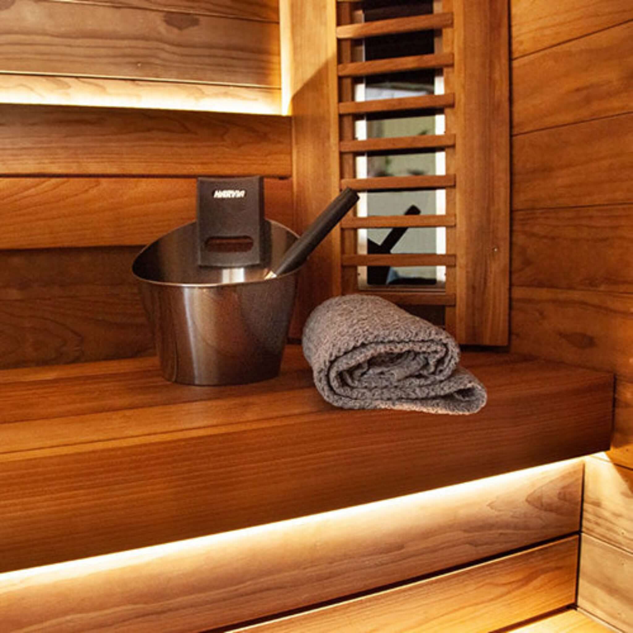 Harvia sauna accessory set — lifestyle inside sauna view