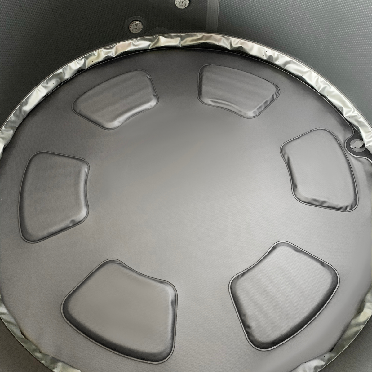 Interior view of the MSPA MONO Verto Series rigid hot tub with soft padded seating.