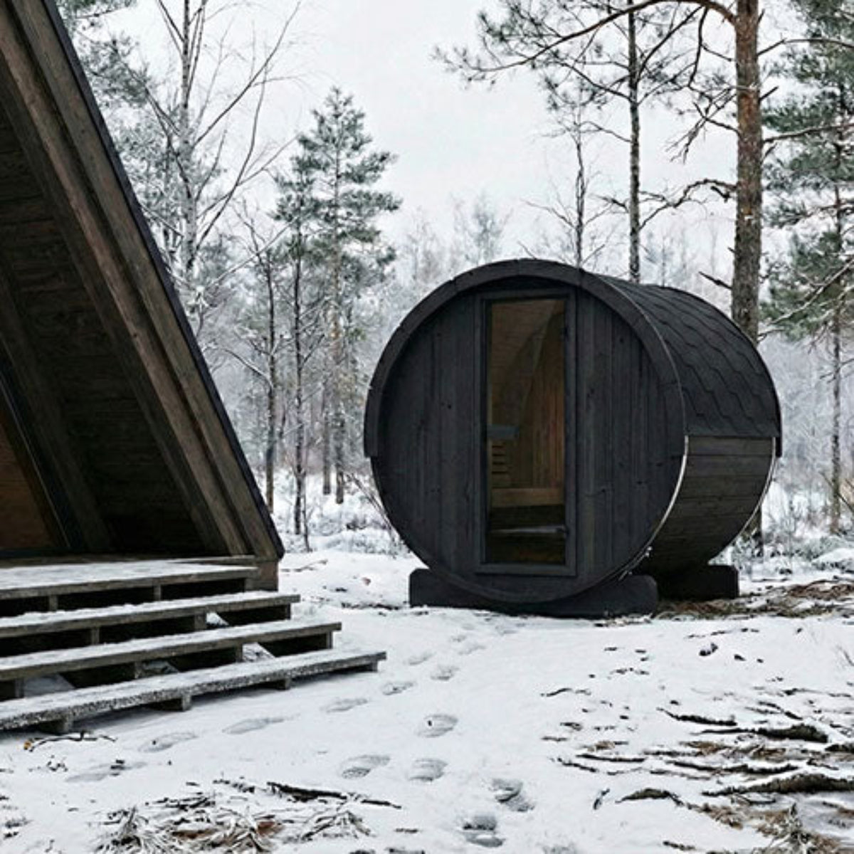 SaunaLife Model E6B Outdoor Barrel Sauna in an outdoor snow setting