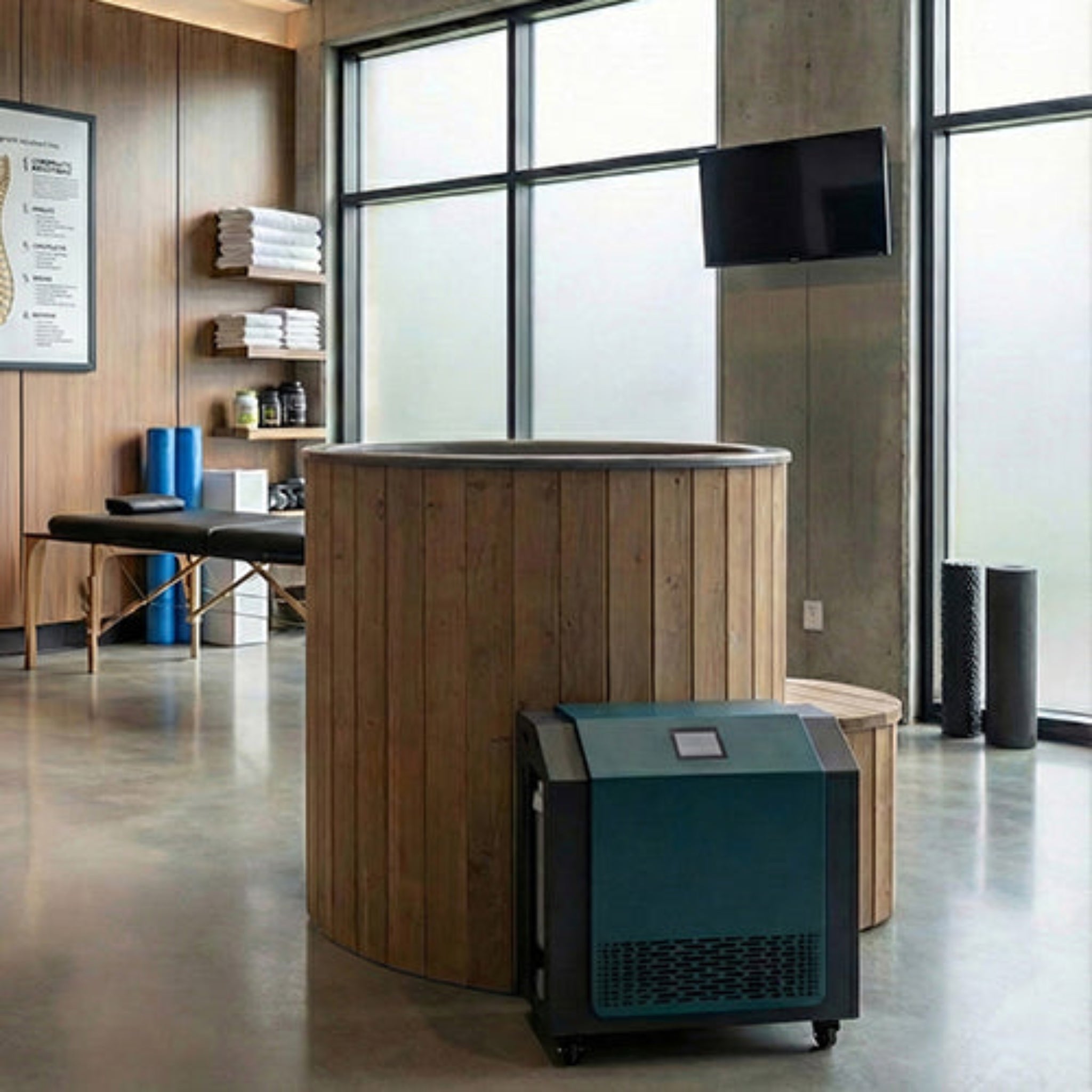 Natural Saunalife black plunge tub with cooler/heater in a recovery room