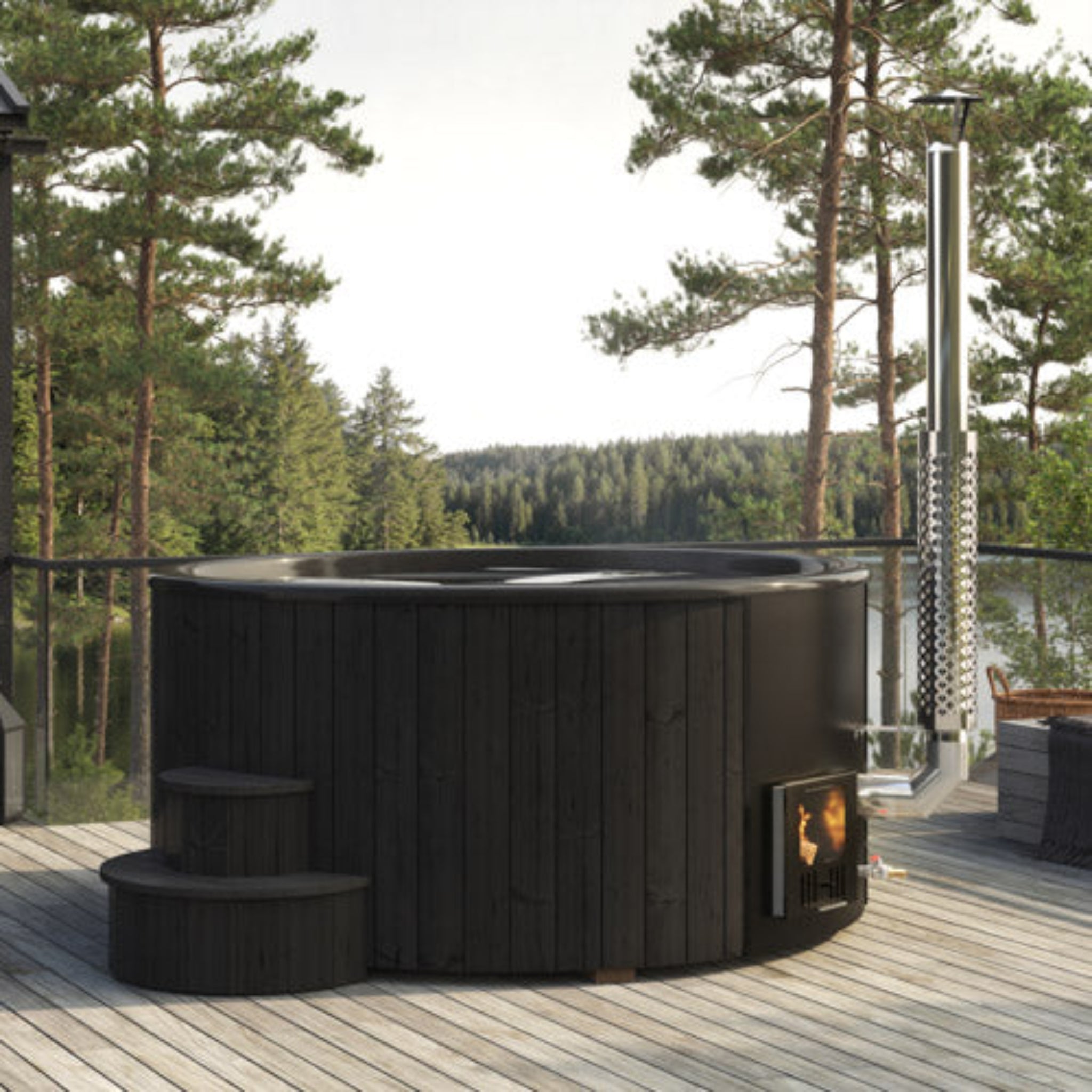Saunalife S6B Black outdoor wood burning hot tub on a wooden deck surrounded by trees
