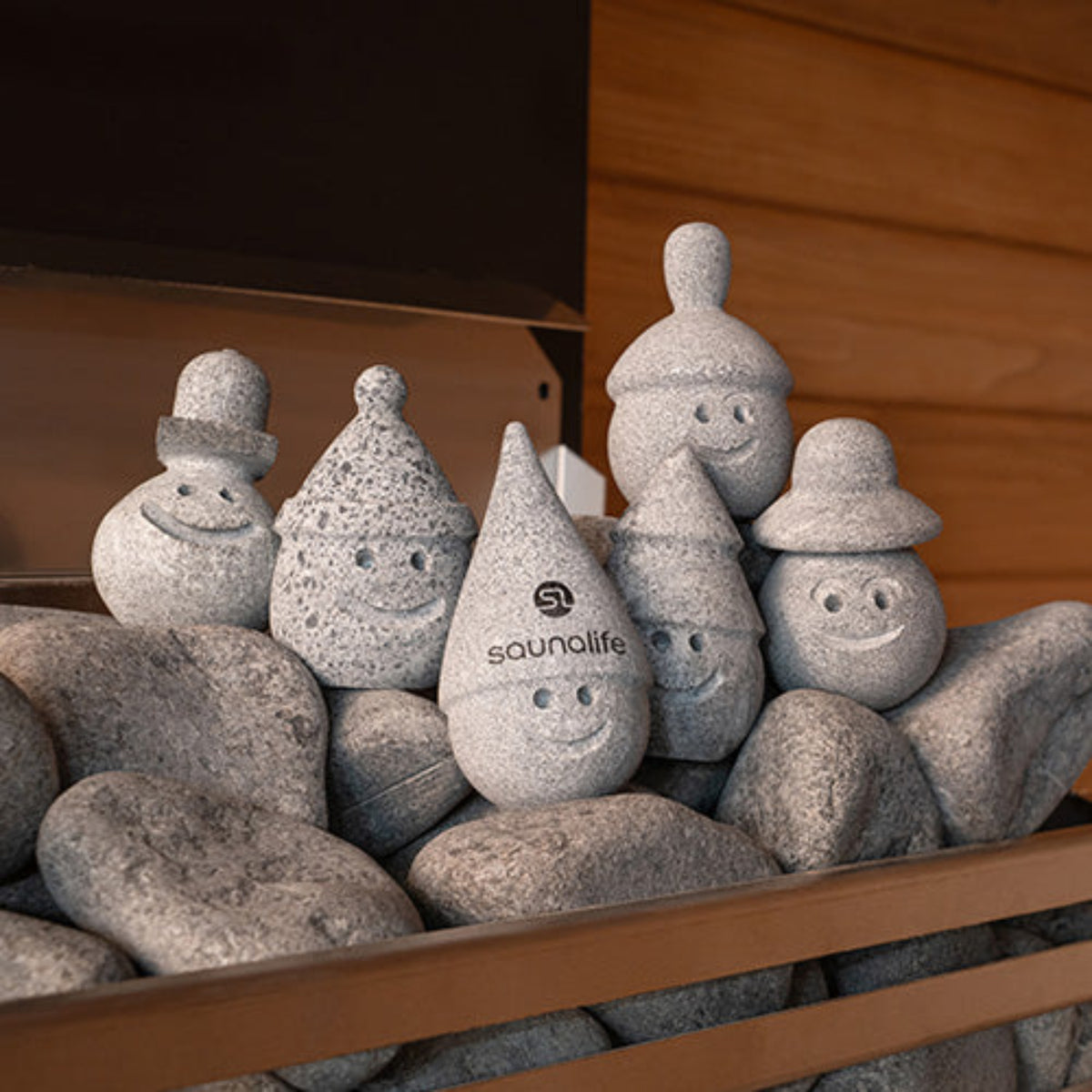 Collection of stone-like figurines with a 'soundlife' logo on a wooden surface