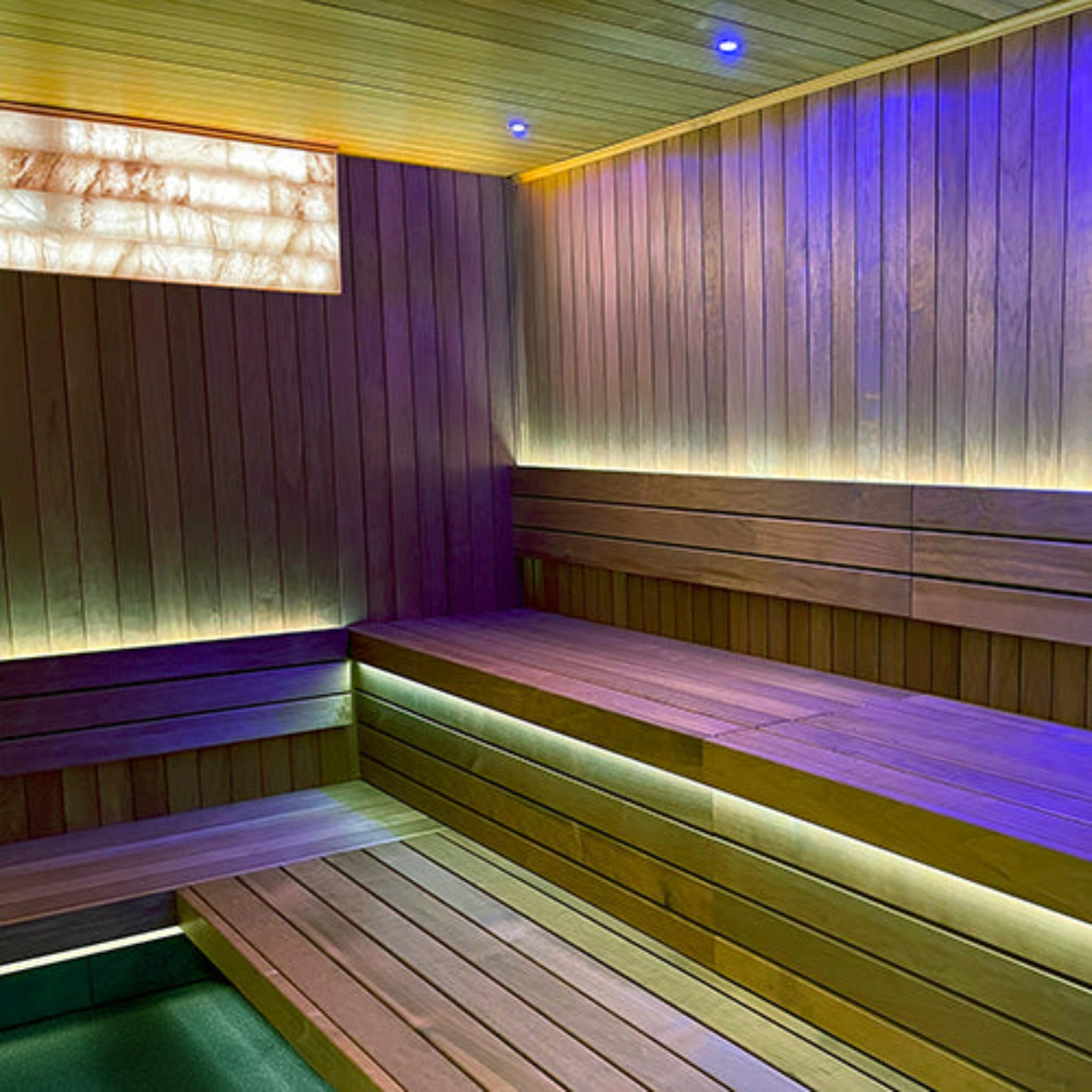 Wooden sauna interior with PROSAUNAS Universal On/Off White LED Himalayan Salt light Kit and benches