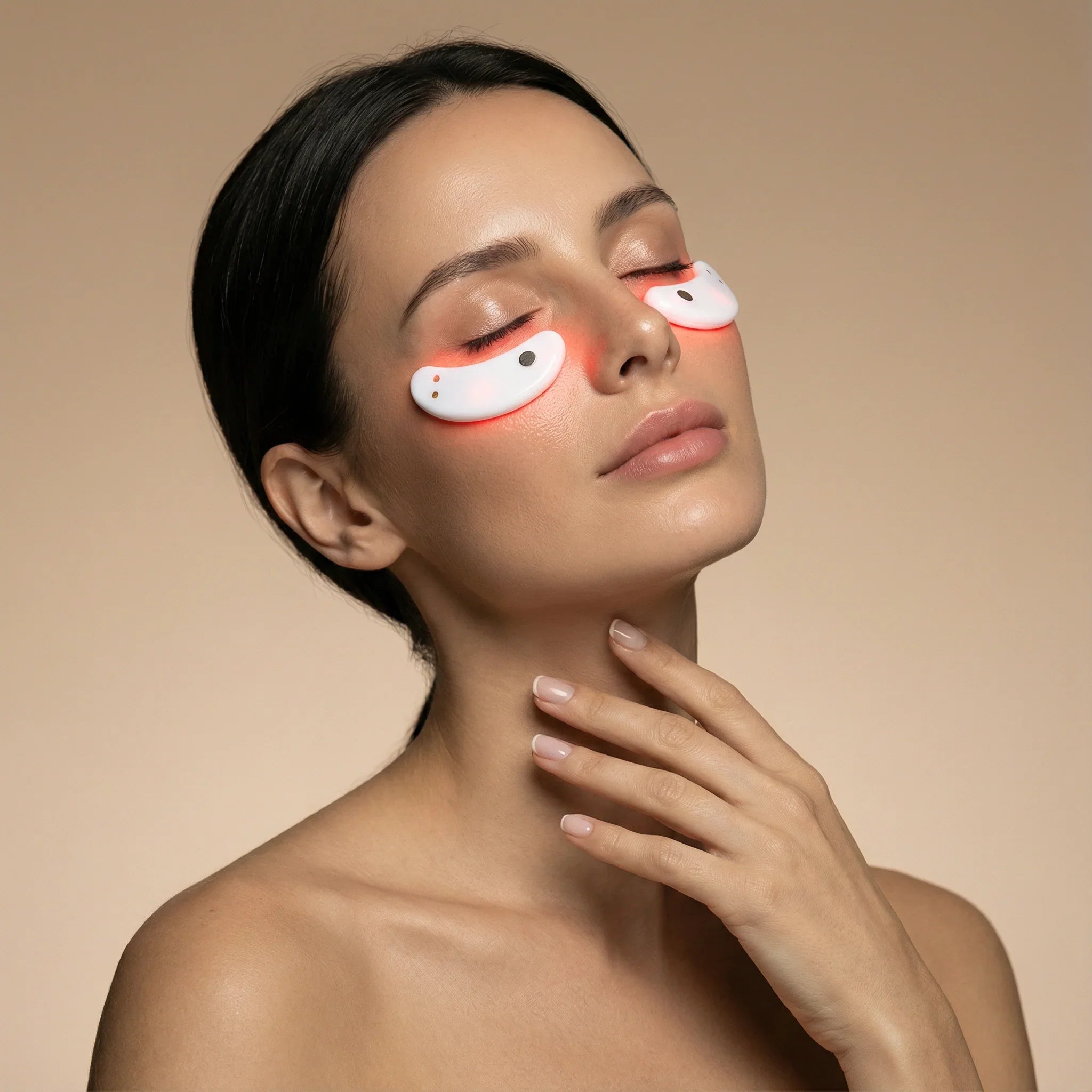 Woman with eye patches on a beige background