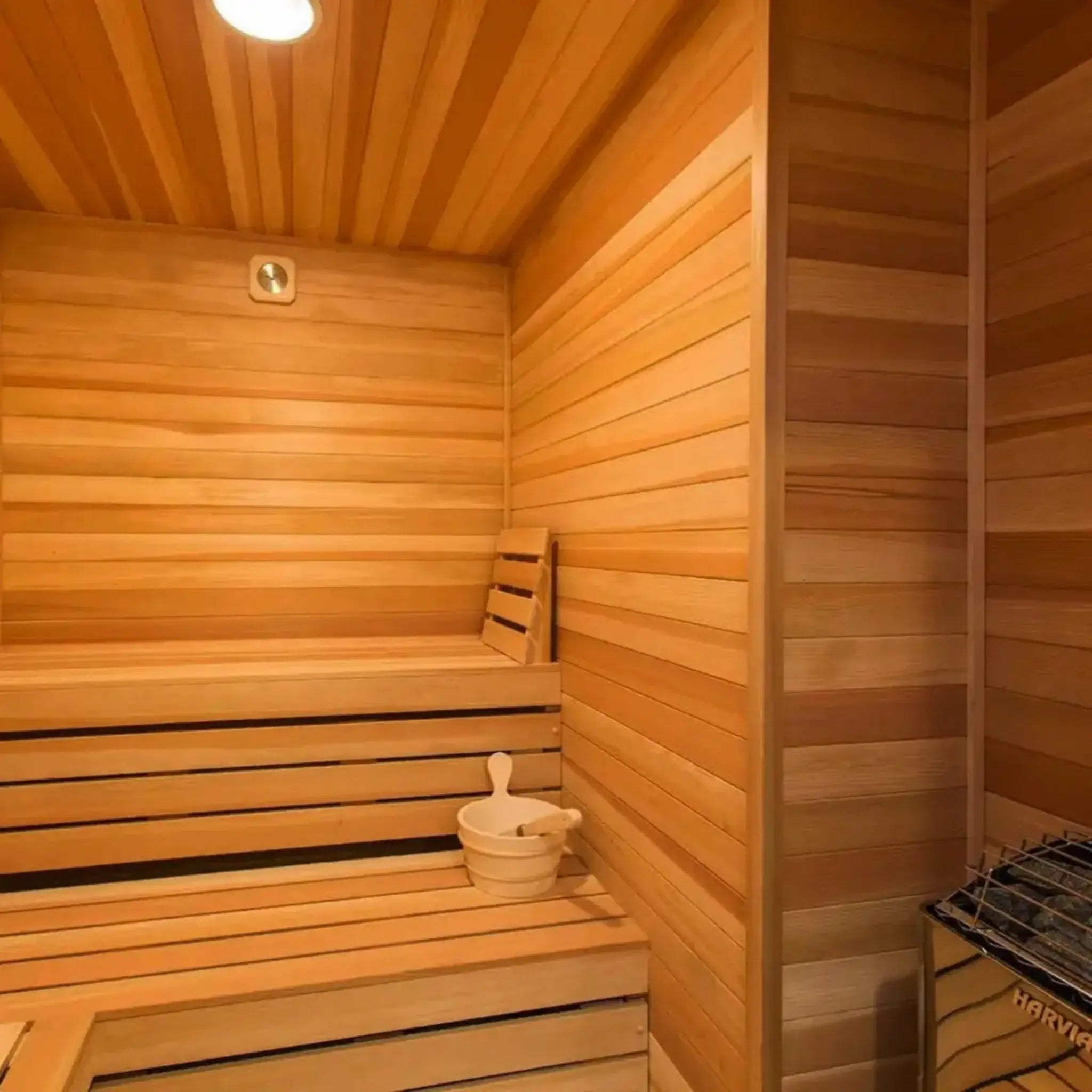Wooden sauna with a bench and a small table inside