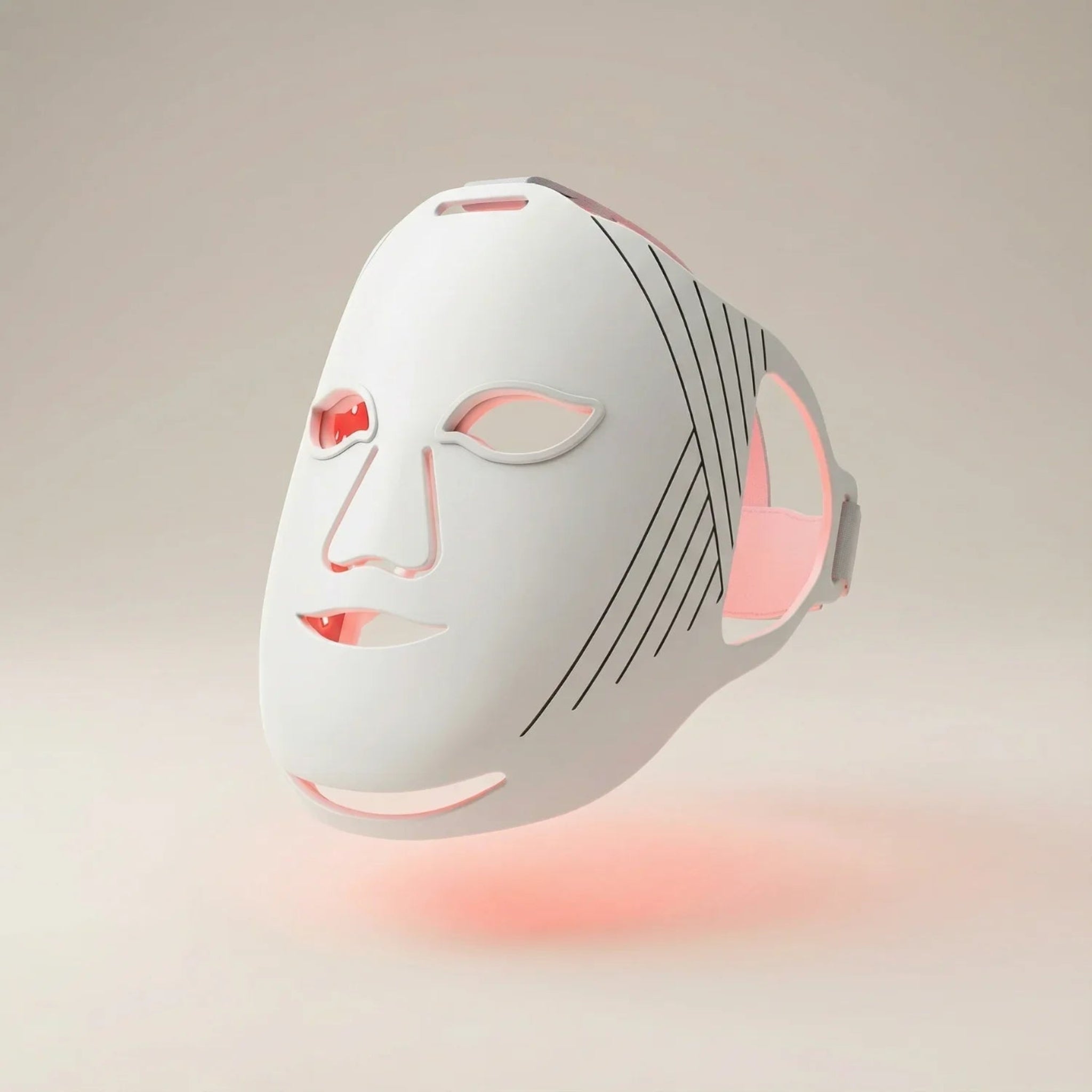 White LED face mask with red and pink lights on a beige background