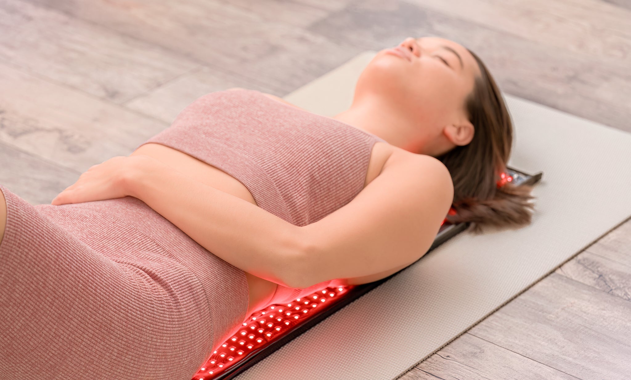 Red Light Pro Devices large therapy pad in use on a model showing full 27 x 11 inch coverage