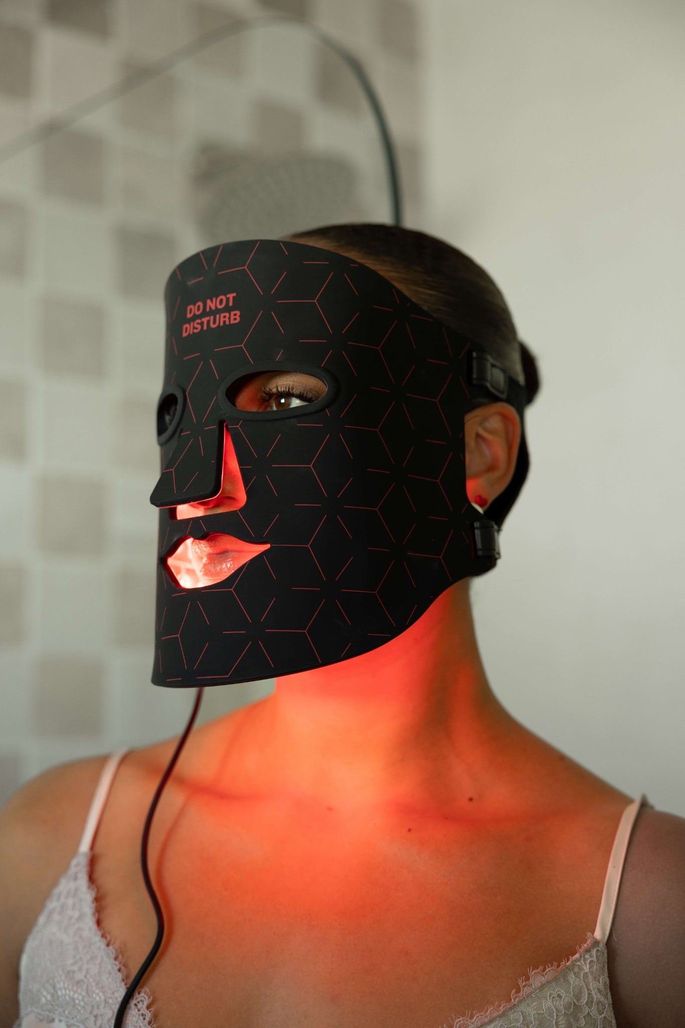 Woman using Renew Red Light LED Therapy Mask