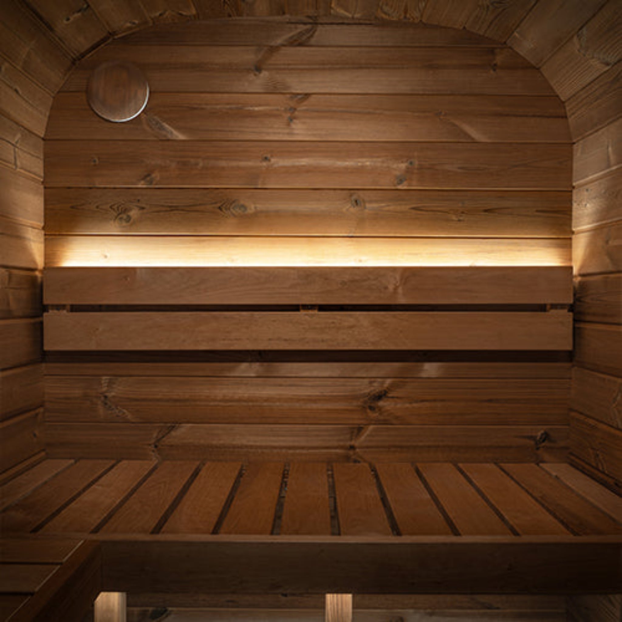 Wooden sauna interior with a bench showing Prosaunas led lights