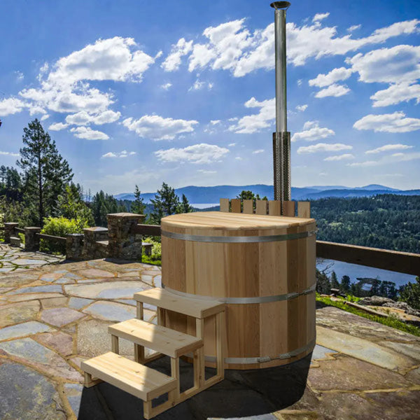 wood hot tub in an outdoor setting by a lake