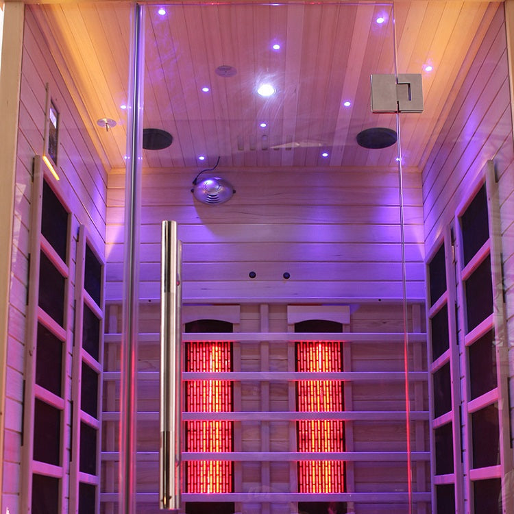 Blisspod Venetian Full Spectrum Infrared Sauna interior with glowing red heaters and ambient lighting.