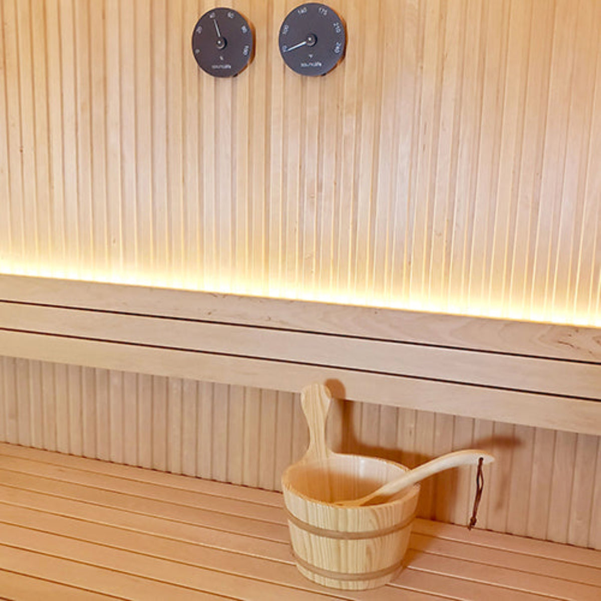 Wood Sauna Bucket and Ladle Set w/ Black Thermometer and Hygrometer hanging on sauna wall