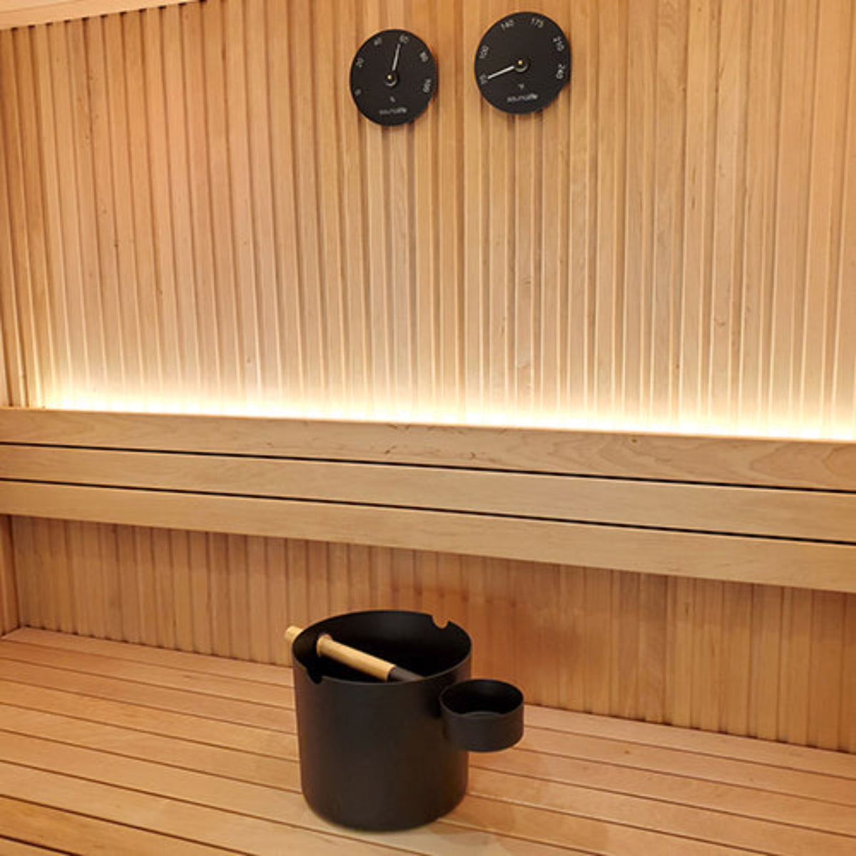 SaunaLife Essentials Set 5 Aluminum Sauna Bucket and Ladle Set w/ Black and Thermometer and Hygrometer hanging on wooden sauna wall