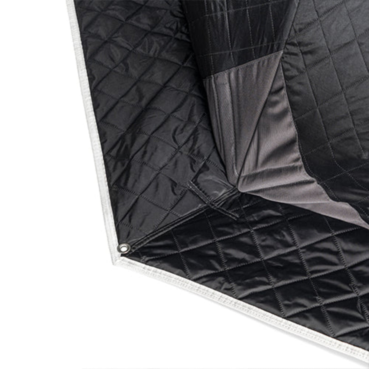 Close-up of a black SaunaLife SaunaTrekker XL Portable Sauna Tent with  a gray inner lining, shown folded on a white background.