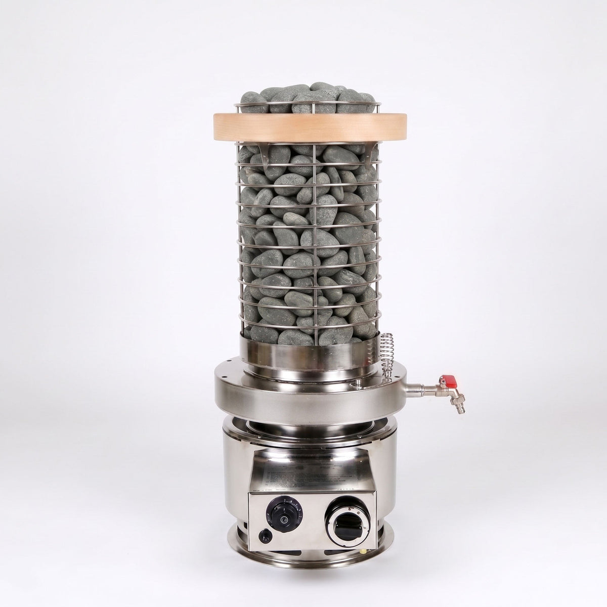 A stainless steel hot stone bath heater with a cylindrical wire mesh container filled with smooth gray stones, topped with a light wood lid, and mounted on a circular electric base with a small side spout and red valve.