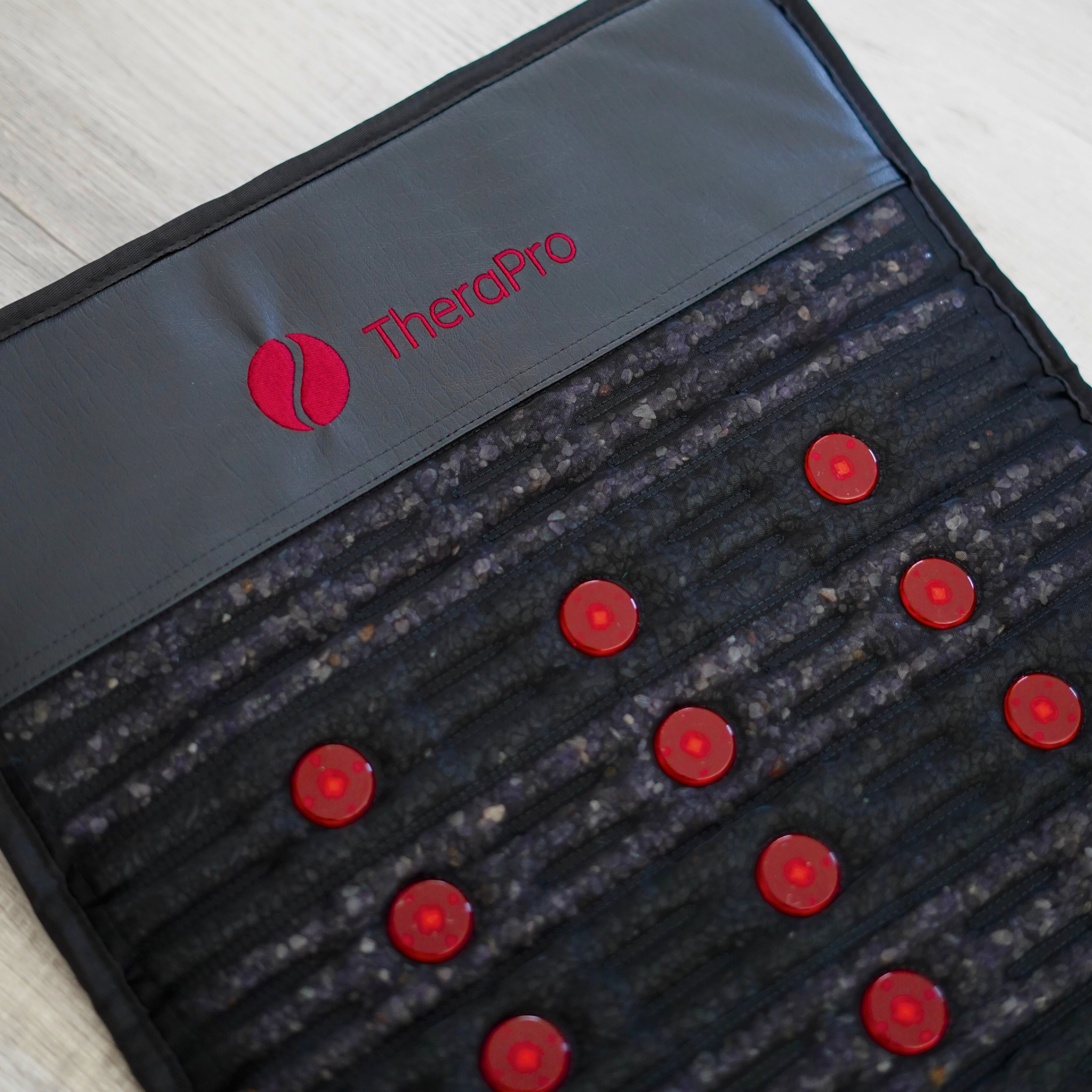 TheraPro PEMF infrared red light therapy recovery pad featuring red light elements for wellness and relaxation.