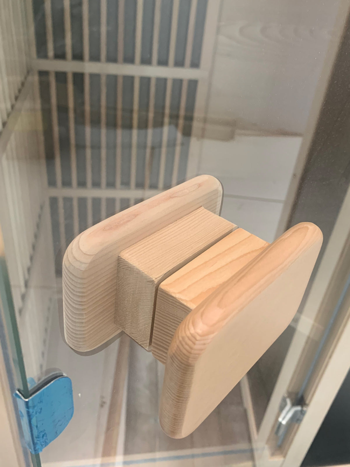 Blisspod Vienna Far Infrared Sauna wooden handle close-up detail, showcasing craftsmanship and elegant design.