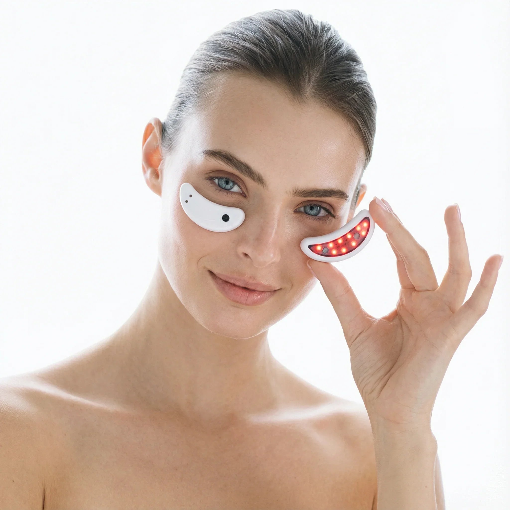 Woman wearing LED eye patches on a white background