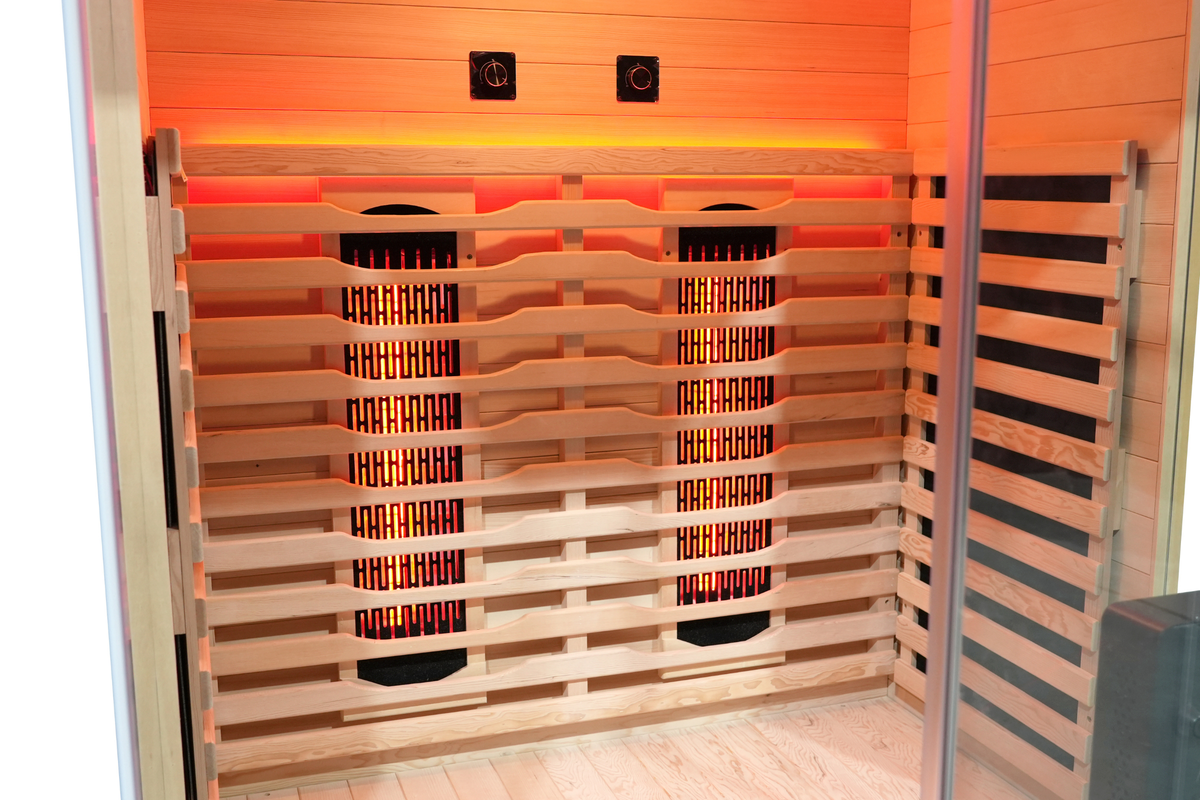 Interior of a full spectrum infrared sauna showcasing heating panels and warm lighting for relaxation therapy.