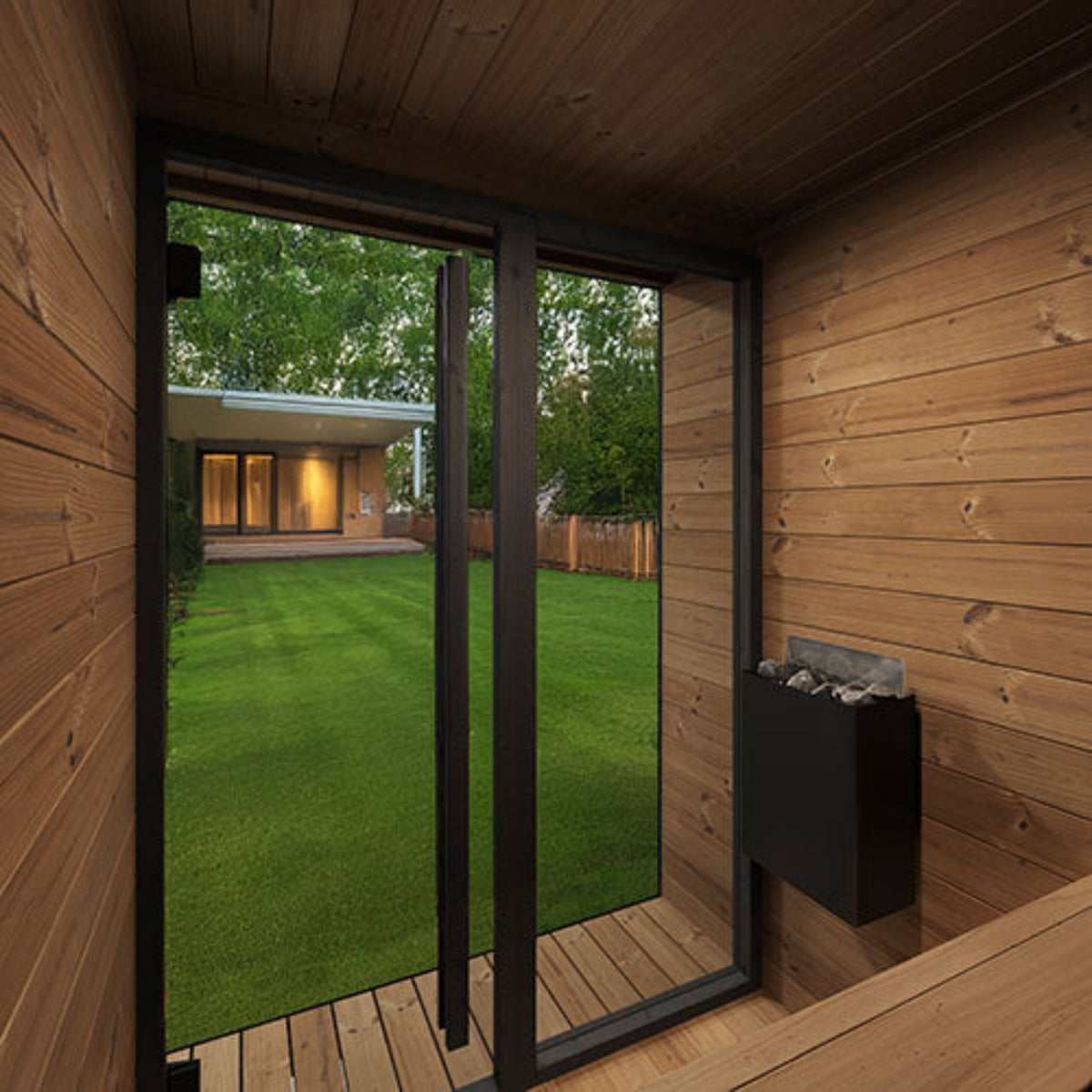 SaunaLife Garden Luxury-Series GL4B cabin interior with a view of a garden through a glass door.