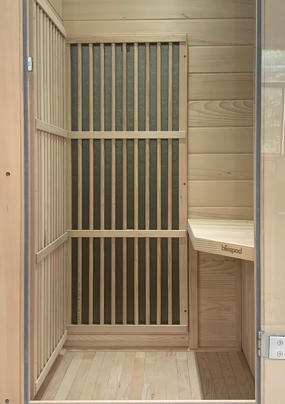 Interior view of Blisspod Vienna 1-Person Far Infrared Sauna showcasing Canadian Hemlock design.