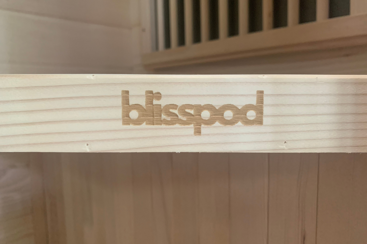 blisspod logo on a wooden panel of the Blisspod Vienna 1-Person Far Infrared Sauna