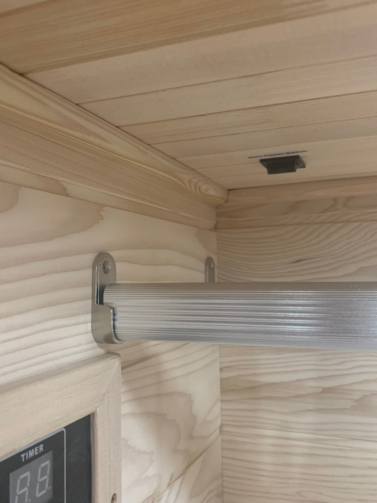 Interior view of Blisspod Vienna 1-Person Far Infrared Sauna showcasing sleek wooden design and integrated controls.