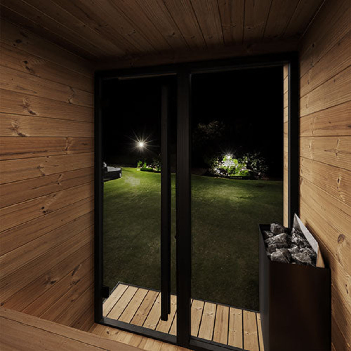 SaunaLife Garden Luxury-Series GL4B interior with a view of a garden at night