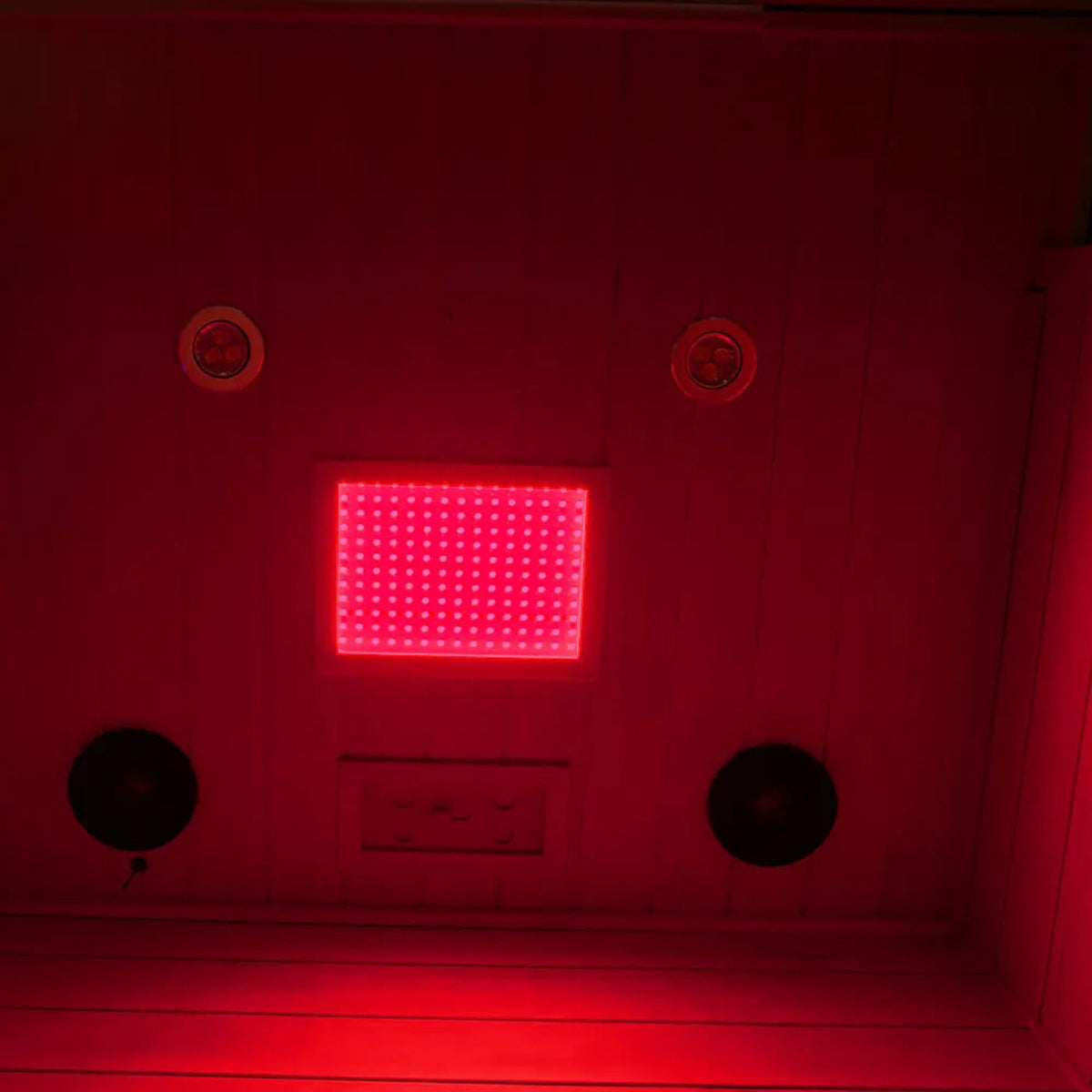 Interior view of a 2-person infrared sauna hemlock with red lighting and sound system.