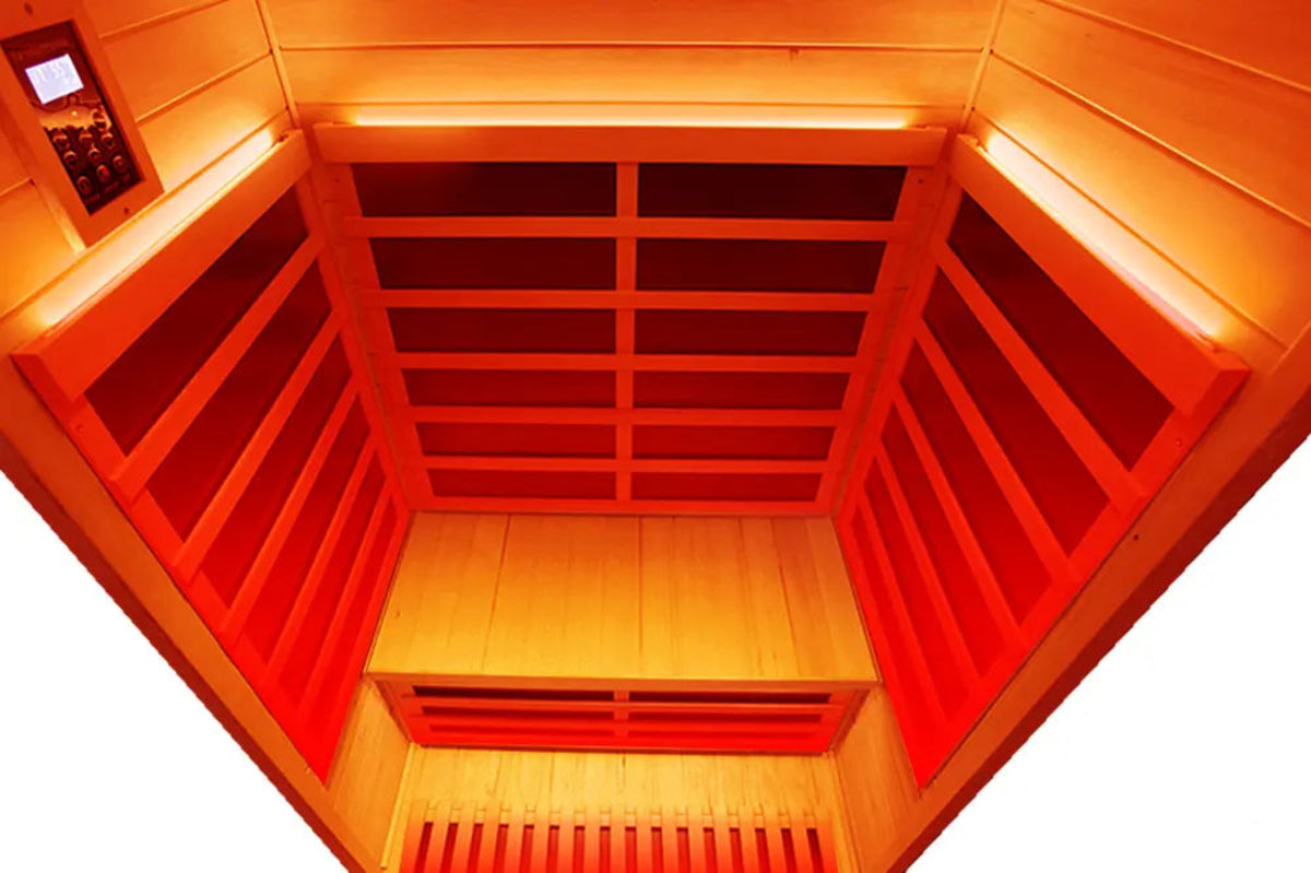 Interior view of a 2-person infrared sauna hemlock by Wizzisaunas, featuring full-spectrum heating and wooden panels.