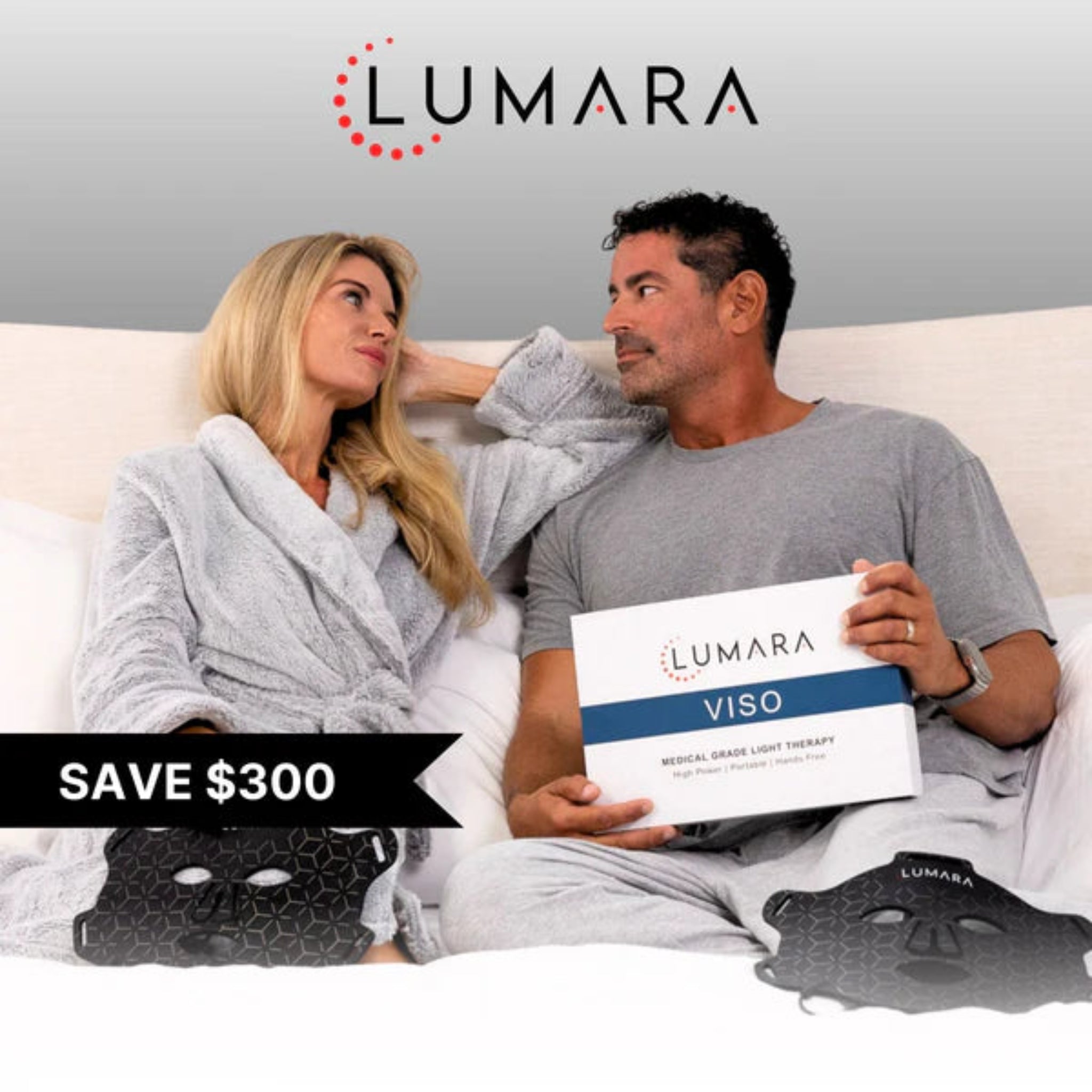 Couple sitting on a couch with Lumara VISO light therapy device, promotional text overlay.