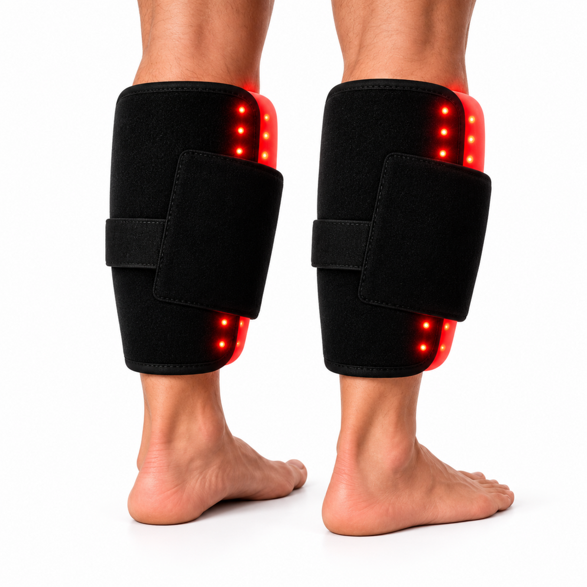 A pair of black LED Red Light Pro therapy leg wraps worn on both legs, shown from the back against a white background. The wraps feature red side panels with glowing red LED lights.